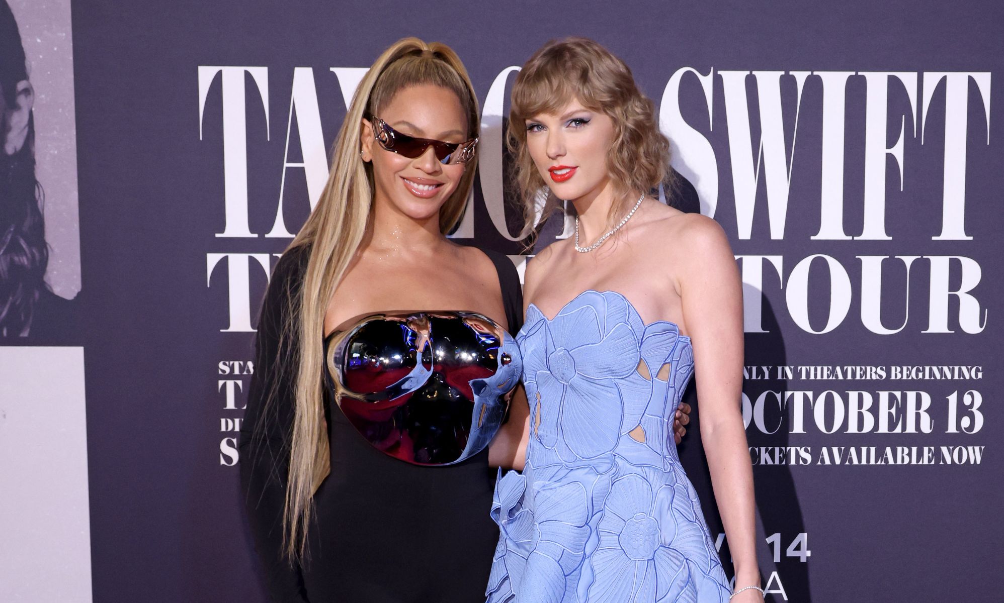 Beyoncé and Taylor Swift stand next to one another at the Taylor Swift: The Eras Tour film premiere.