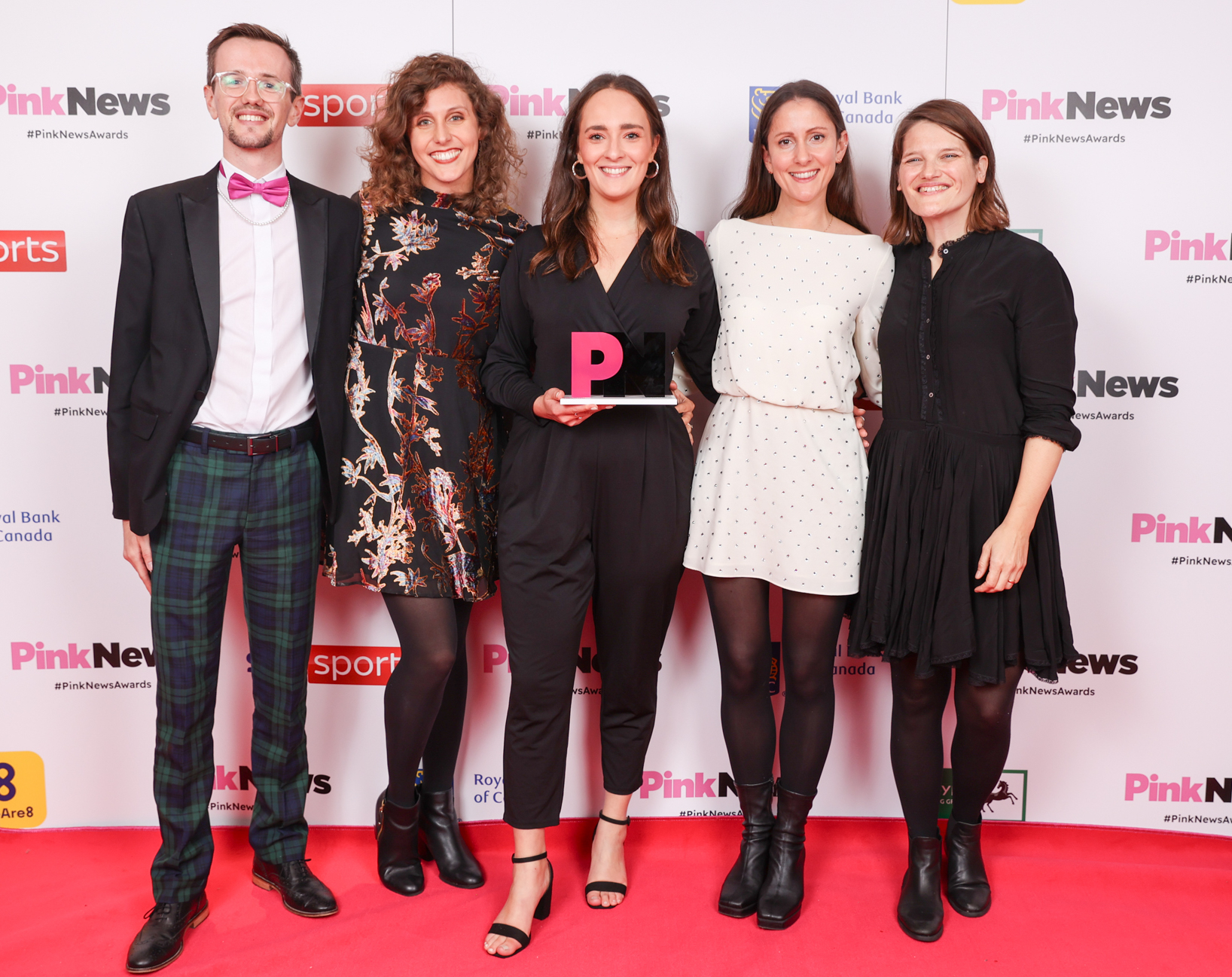 This is an image of a group of people on the red carpet. 