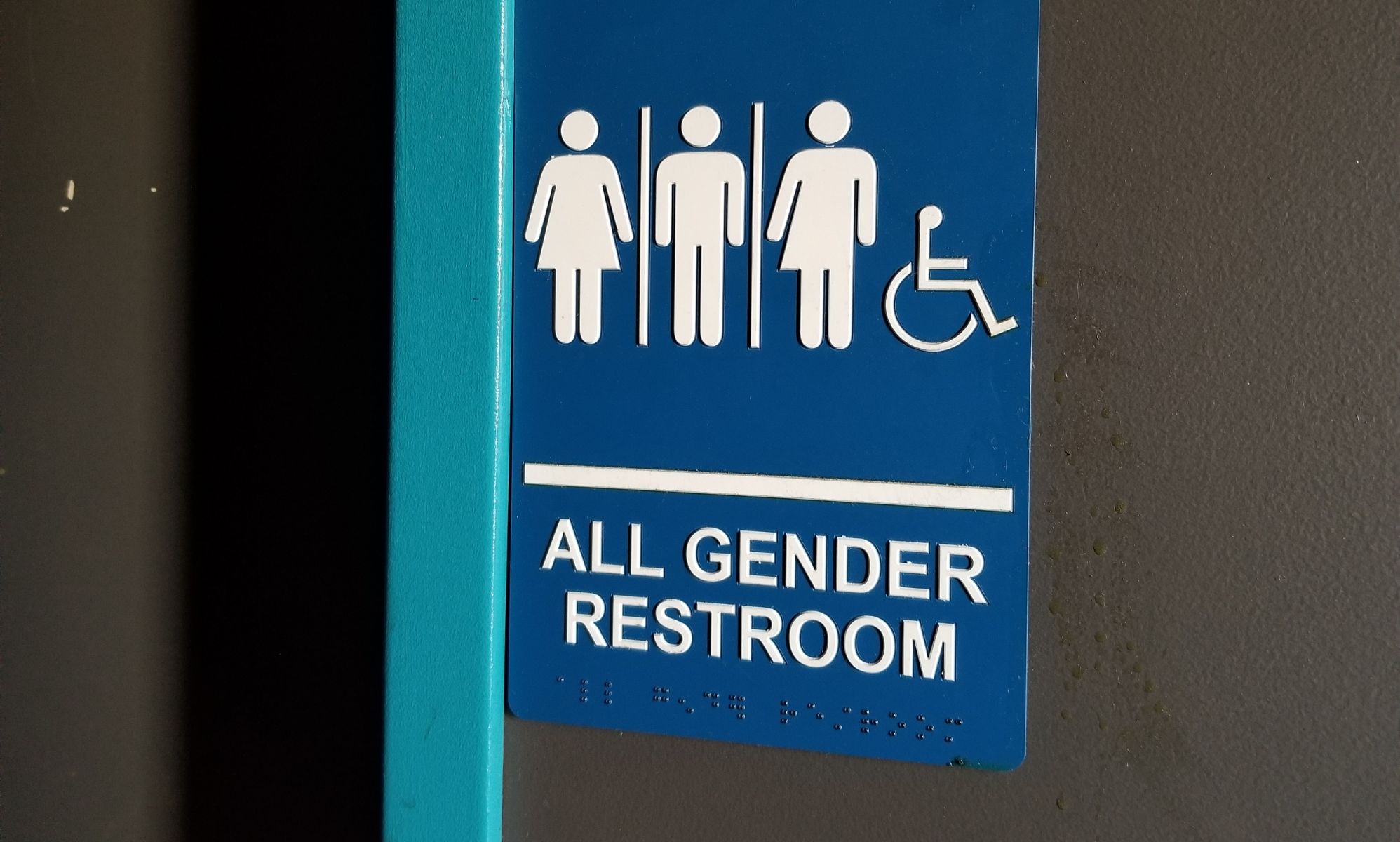 Stock image of a gender-neutral toilet door