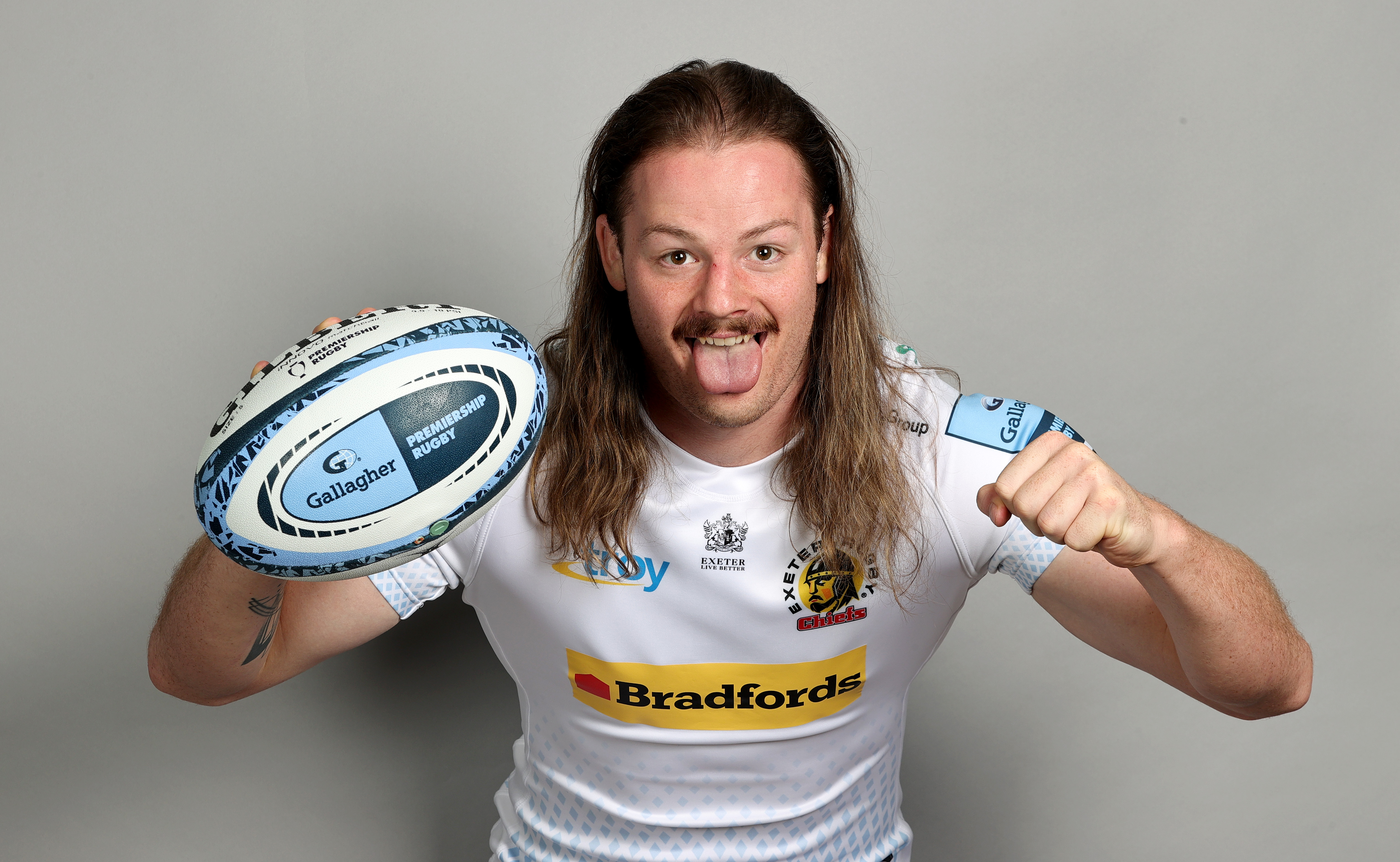 Rugby pro Jack Dunne posing with a rugby ball