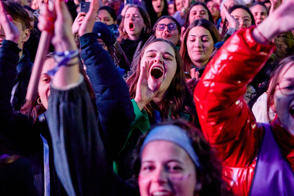 This is an image of people, mostly women, celebrating.