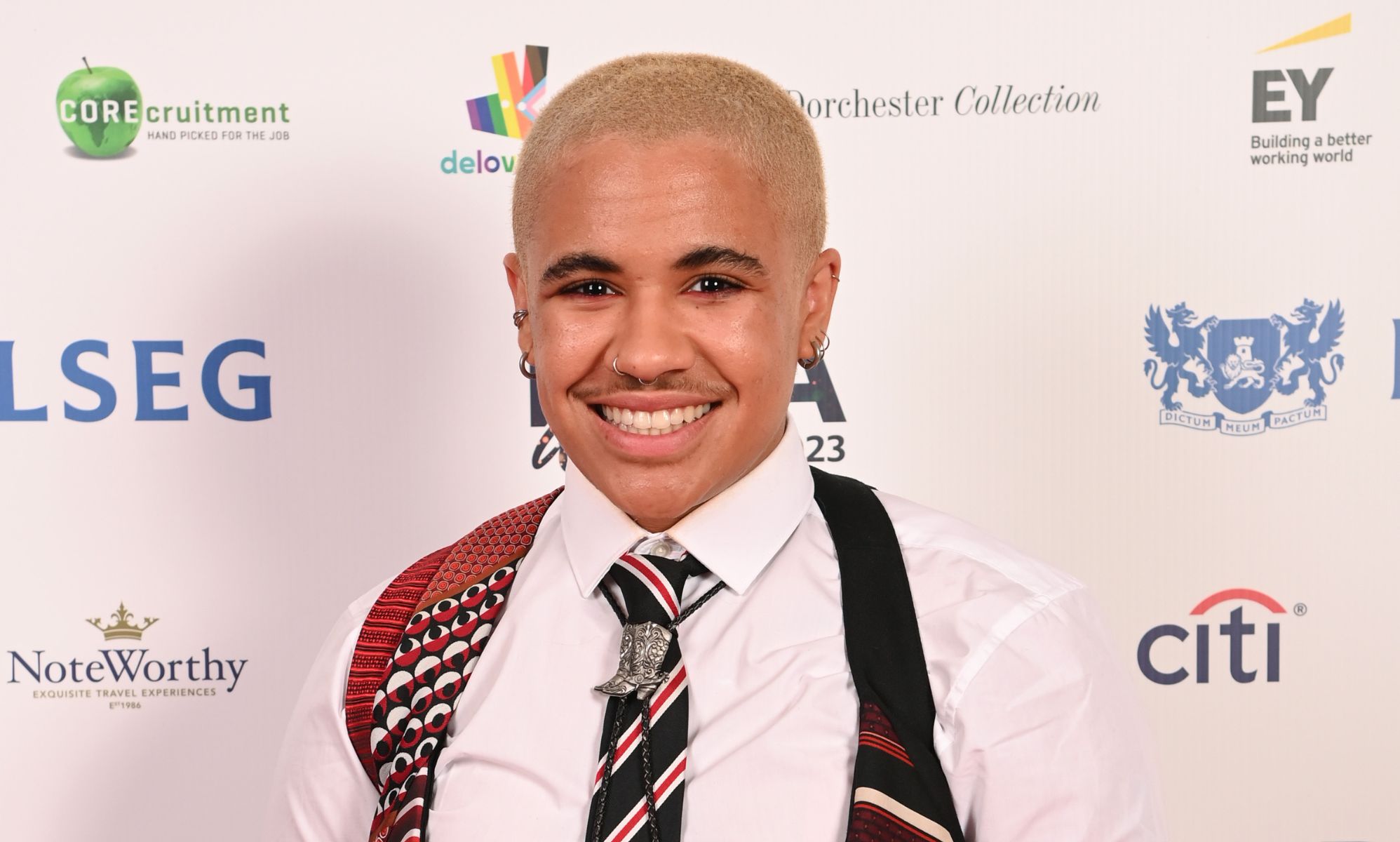 Ki Griffin in a white shirt and multi-coloured tie.