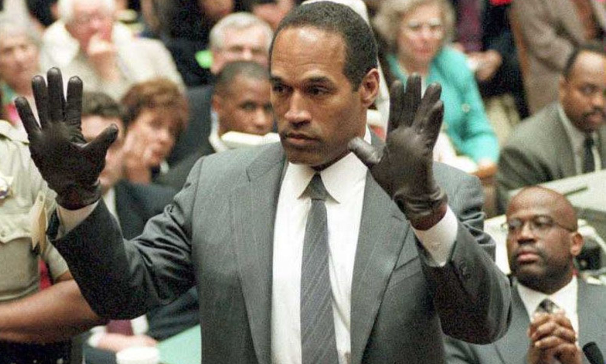 The infamous moment OJ Simpson wore a pair of leather gloves found at the scene of his wife