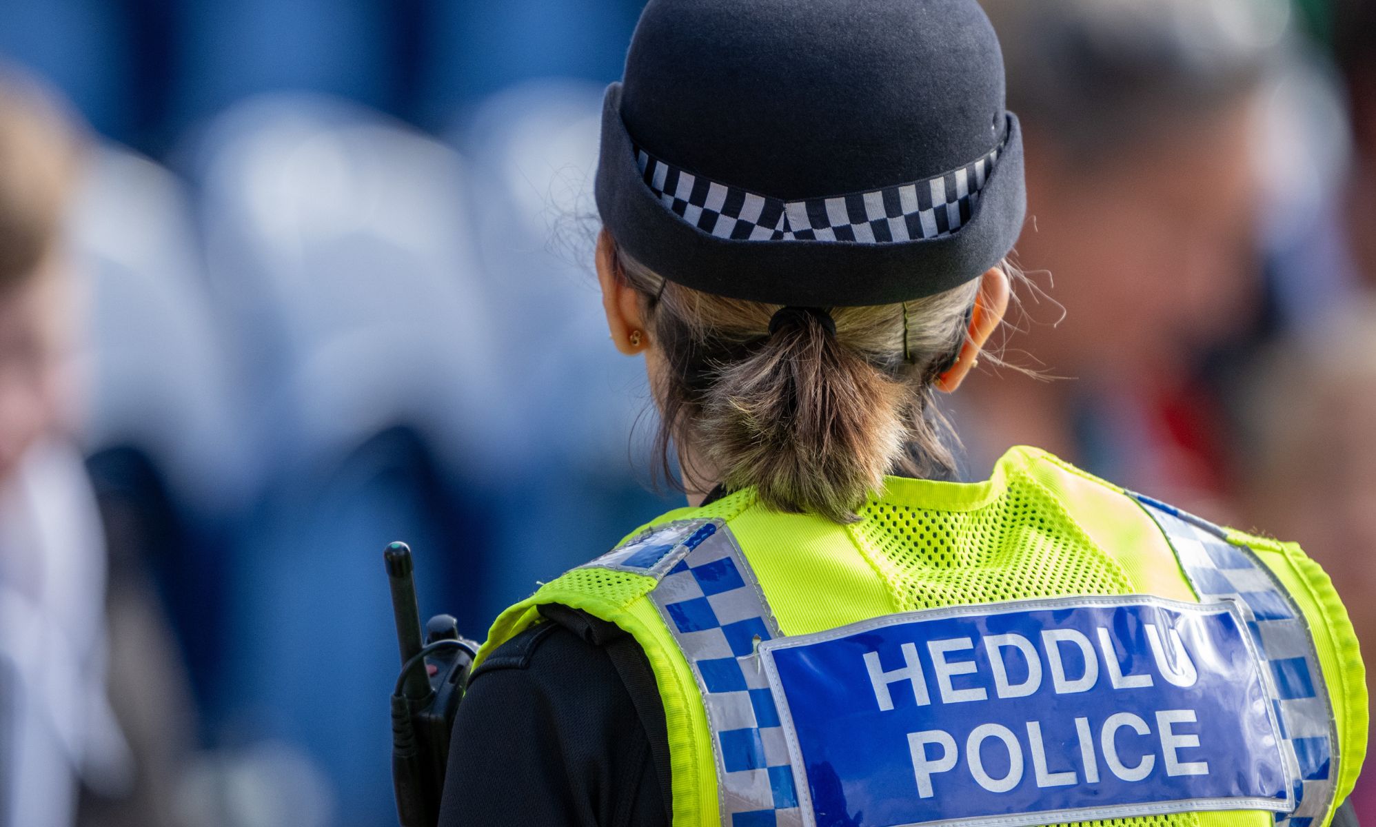 The back of a Wales Police officer.