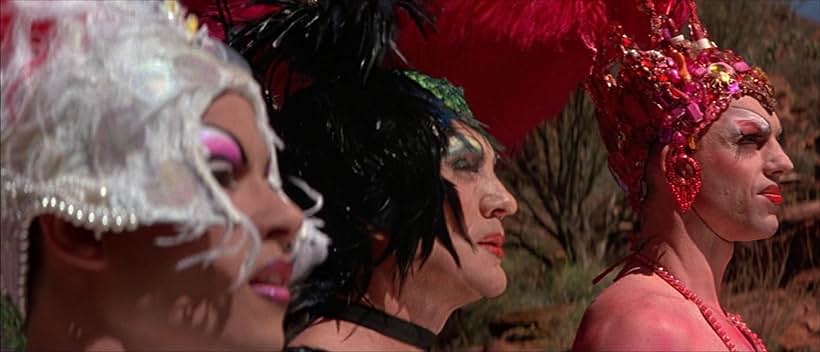 Priscilla Queen of the Desert still: tgree individuals in colourful drag