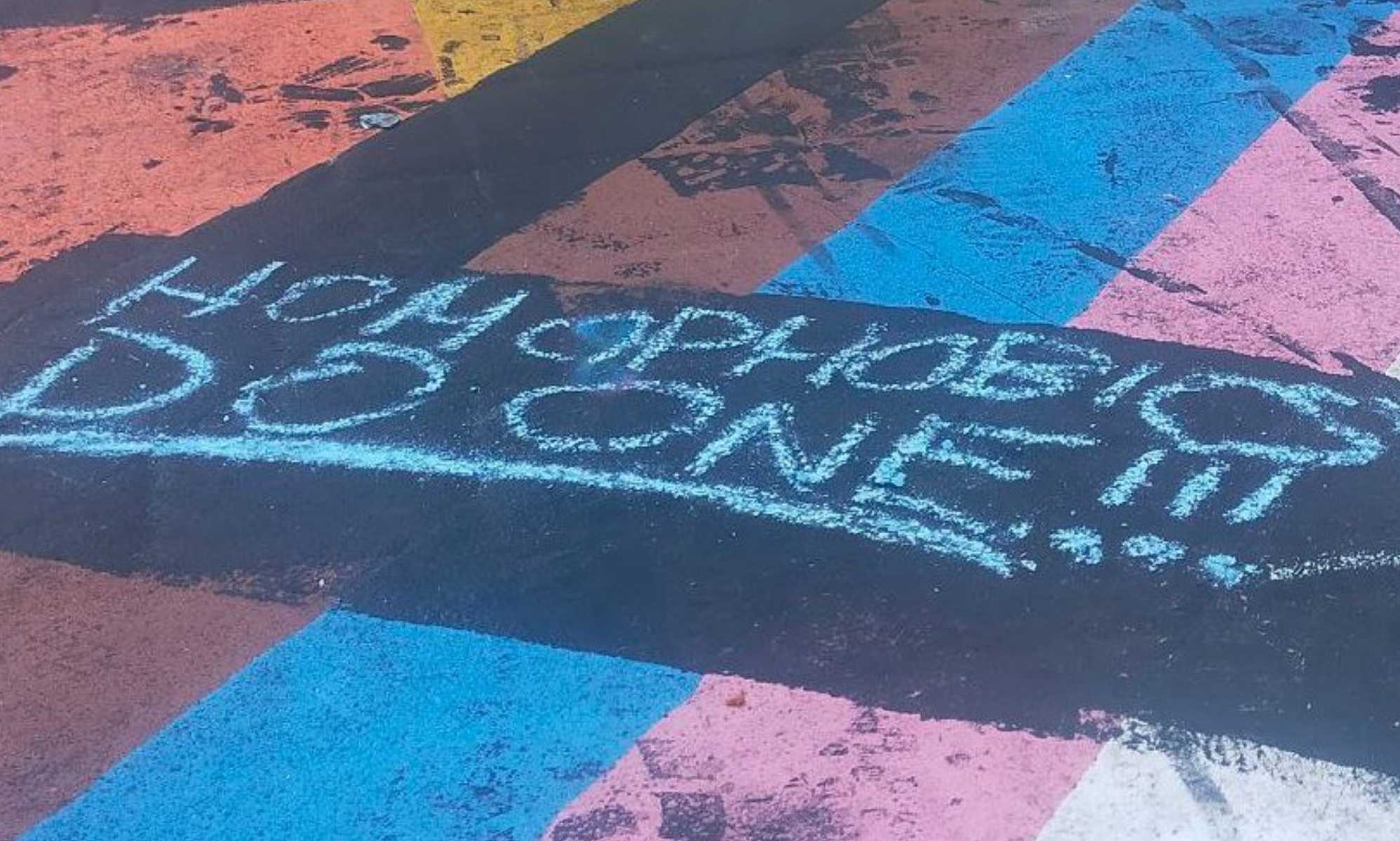 East London residents come together to repair vandalised Pride flags on pavement