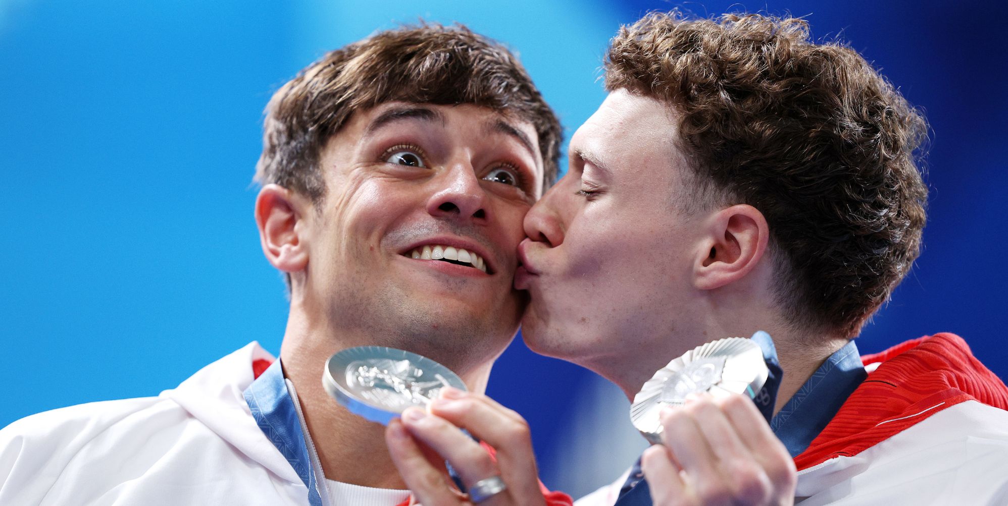 Noah Williams plants kiss on Tom Daley as diving duo celebrate Olympic silver: 'Cutest thing ever'