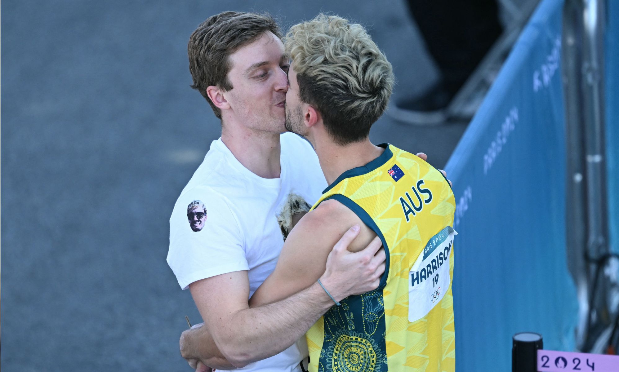 Australian athlete owns homophobic trolls by passionately kissing boyfriend after Olympic loss