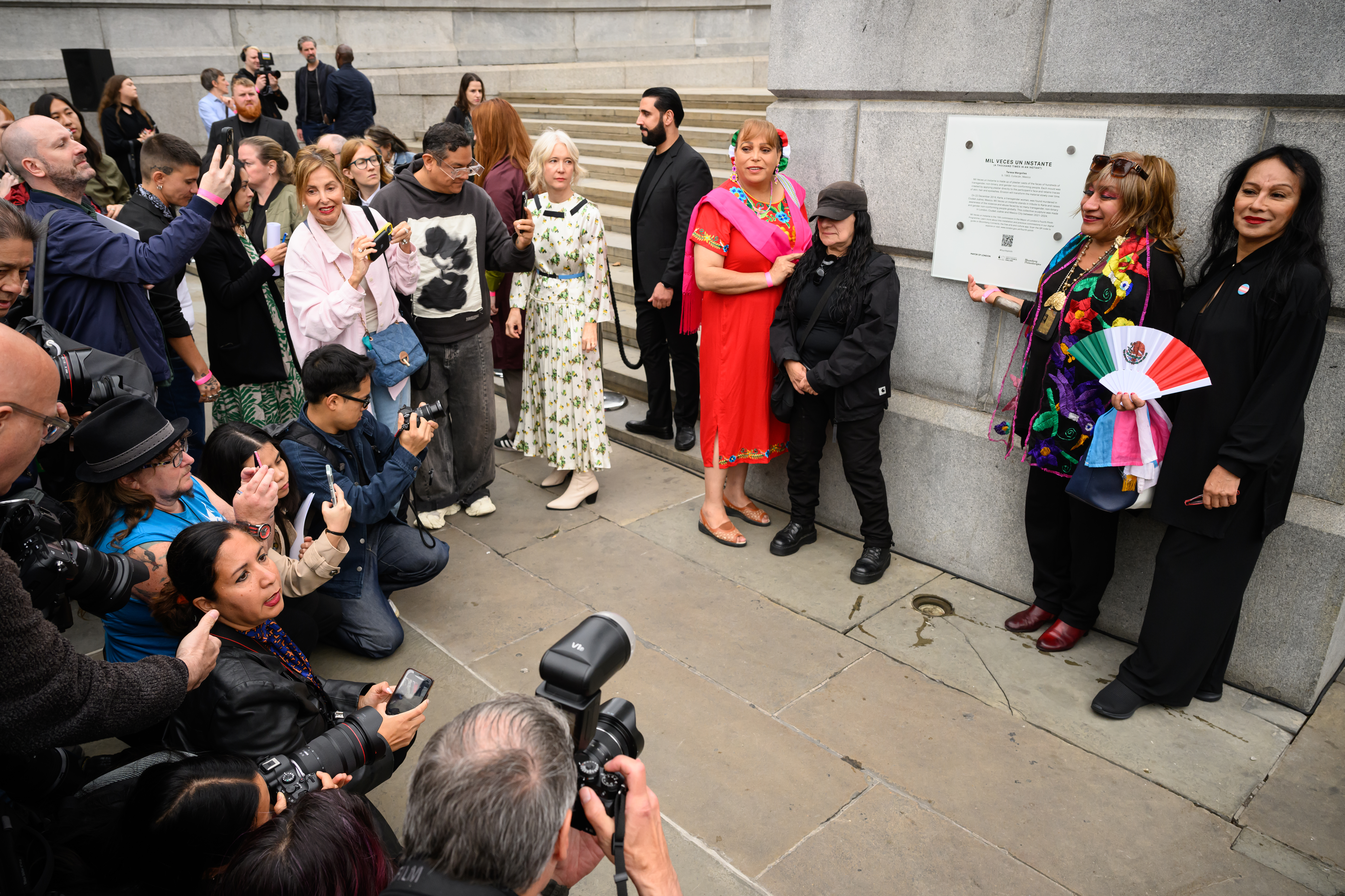Artist Teresas Margolles (C) is seen following the unveiling of the new installation on the fourth plinth, &quot;Mil Veces un Instante&quot;, following its unveiling at Trafalgar Square.