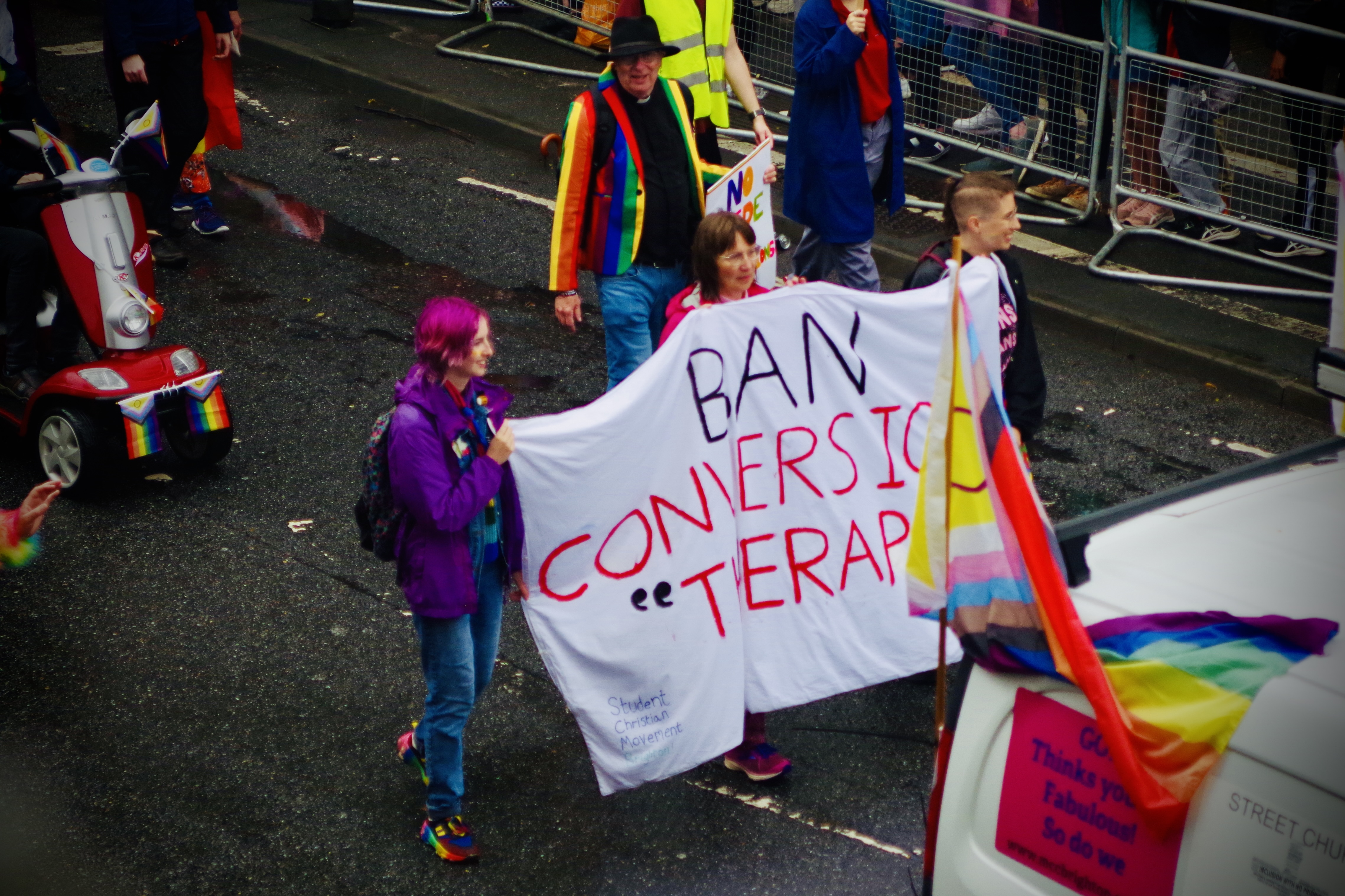 People carrying &quot;Ban Conversion Therapy&quot; banner at Brighton Pride Parade