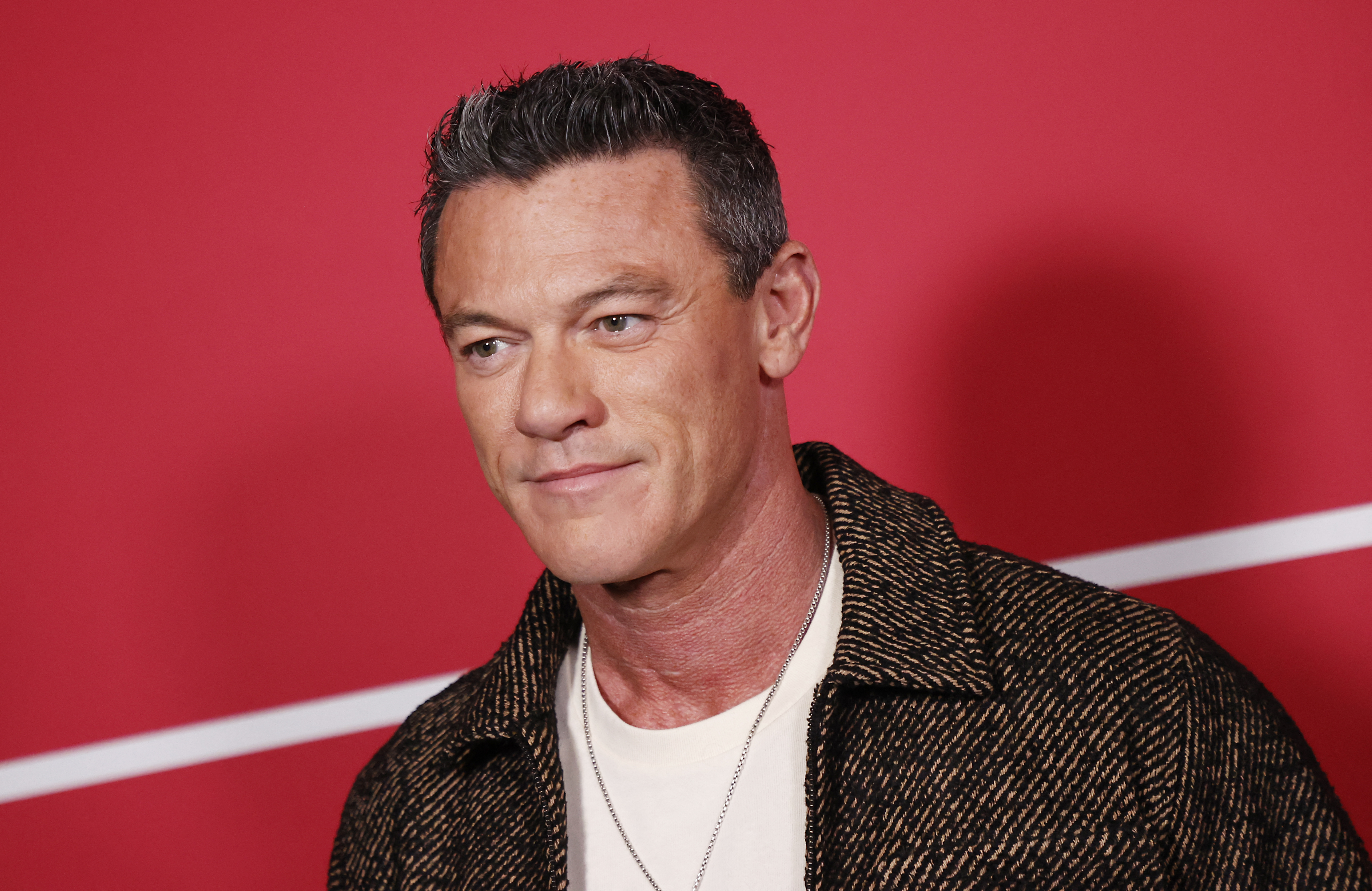 Luke Evans reflects on growing up gay in a 'very religious' Jehovah's Witness household
