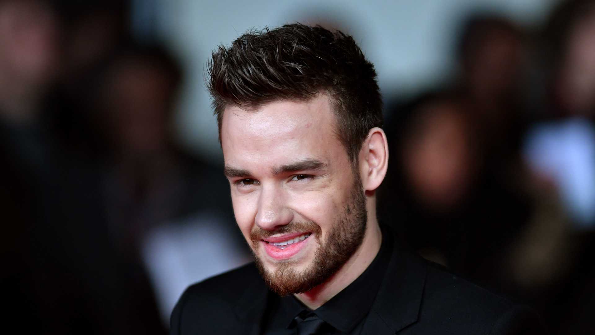 Three charged in connection with Liam Payne's death as star's friend denies claims he 'abandoned him'