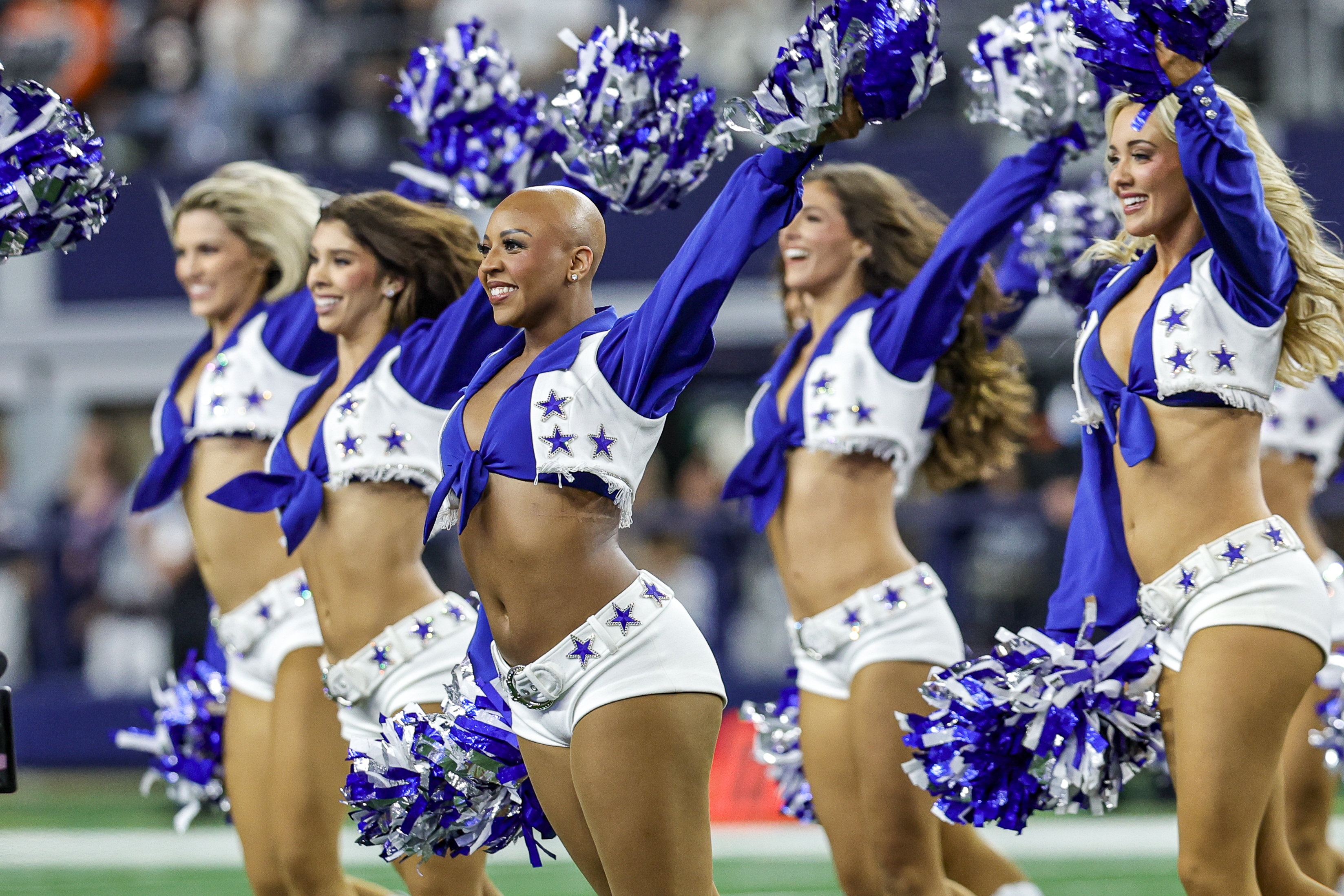 Dallas Cowboys cheerleader with alopecia proudly performs without her wig to raise awareness