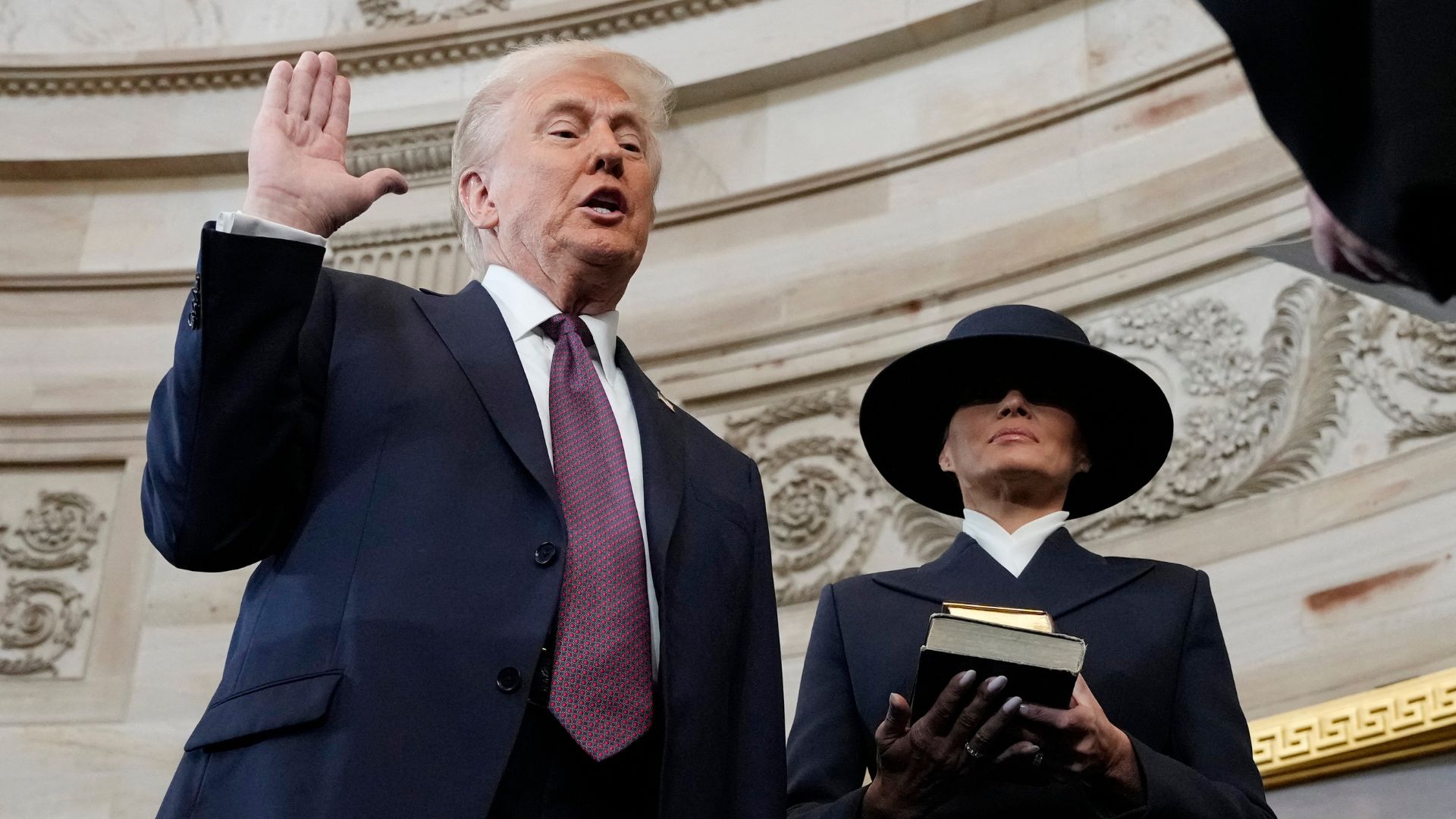 No, Trump didn't put his hand on the Bible while being sworn in - but there is precedent for it