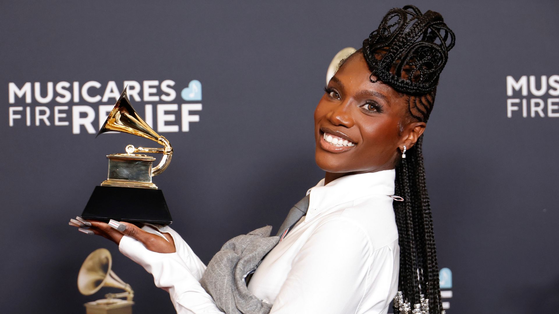 Doechii, winner of the Best Rap Album award for &quot;Alligator Bites Never Heal&quot; poses with her award
