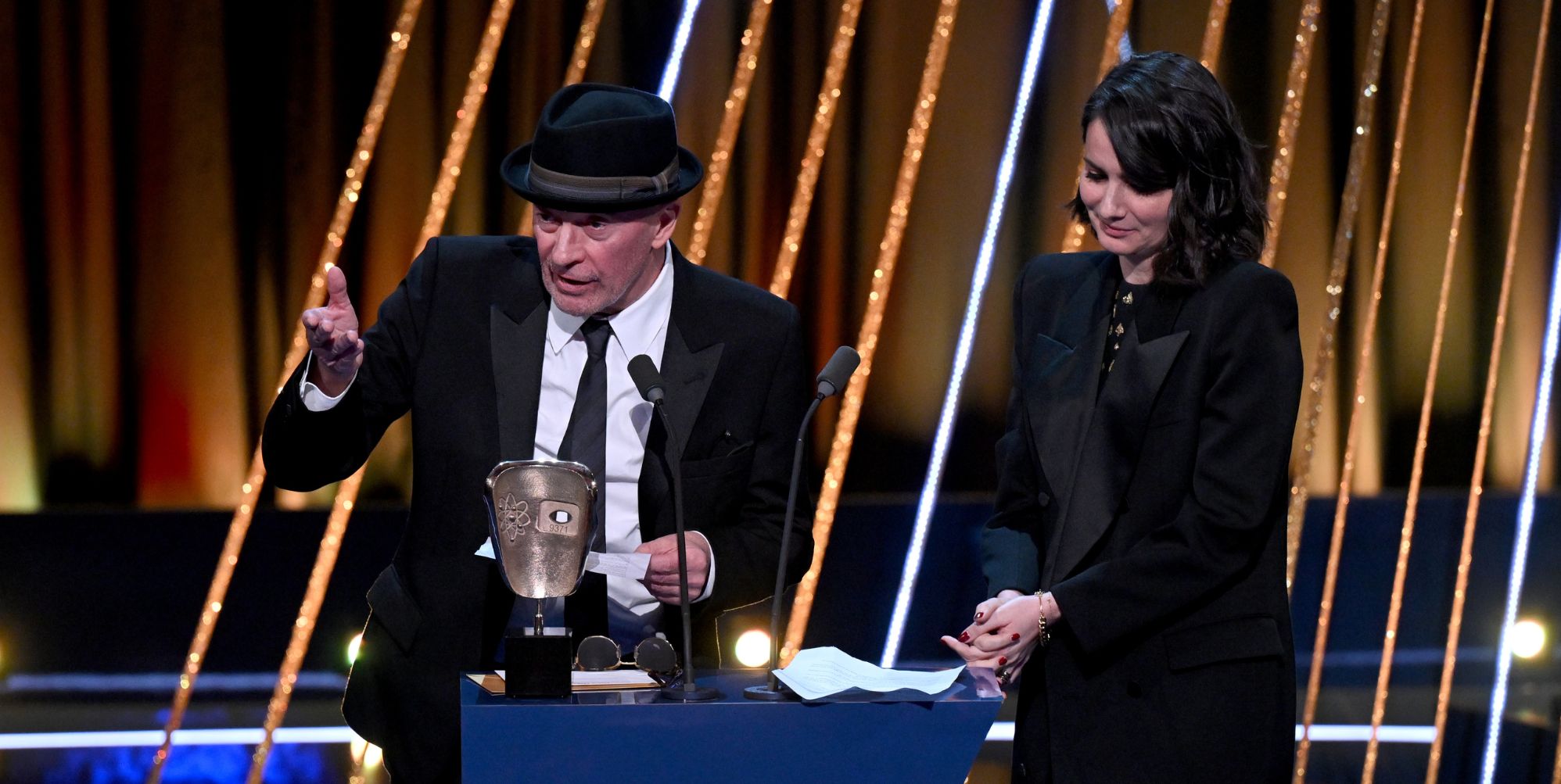 Jacques Audiard accepts the Best Film not in the English language award at the 2025 BAFTAs.