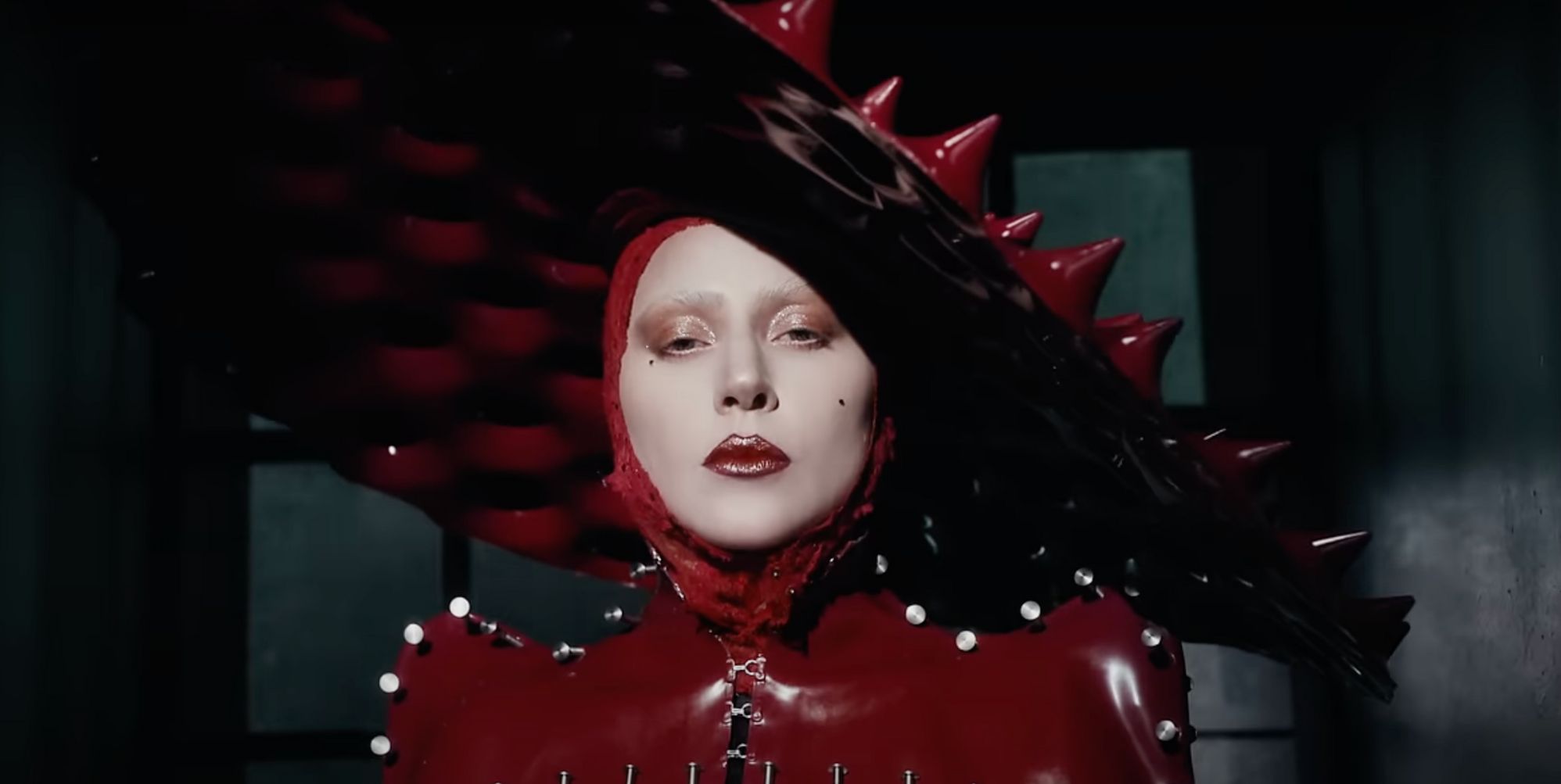 Lady Gaga in a red spiked latex hat in the music video for new single 