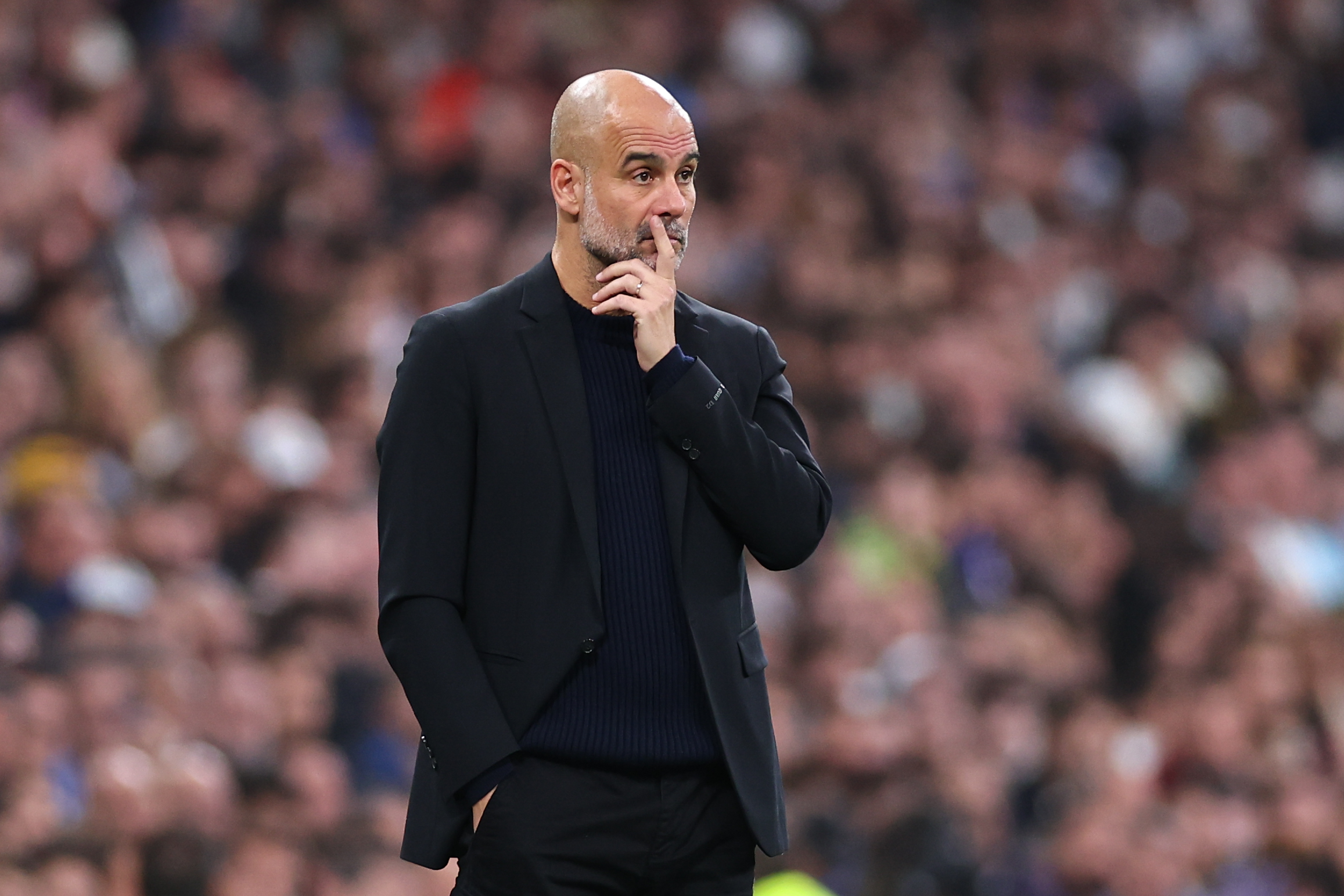 Pep Guardiola manager of Manchester City reacts during the UEFA Champions League 2024/25 League Knockout Play-off second leg match between Real Madrid C.F. and Manchester City at Estadio Santiago Bernabeu on February 19, 2025 in Madrid, Spain.
