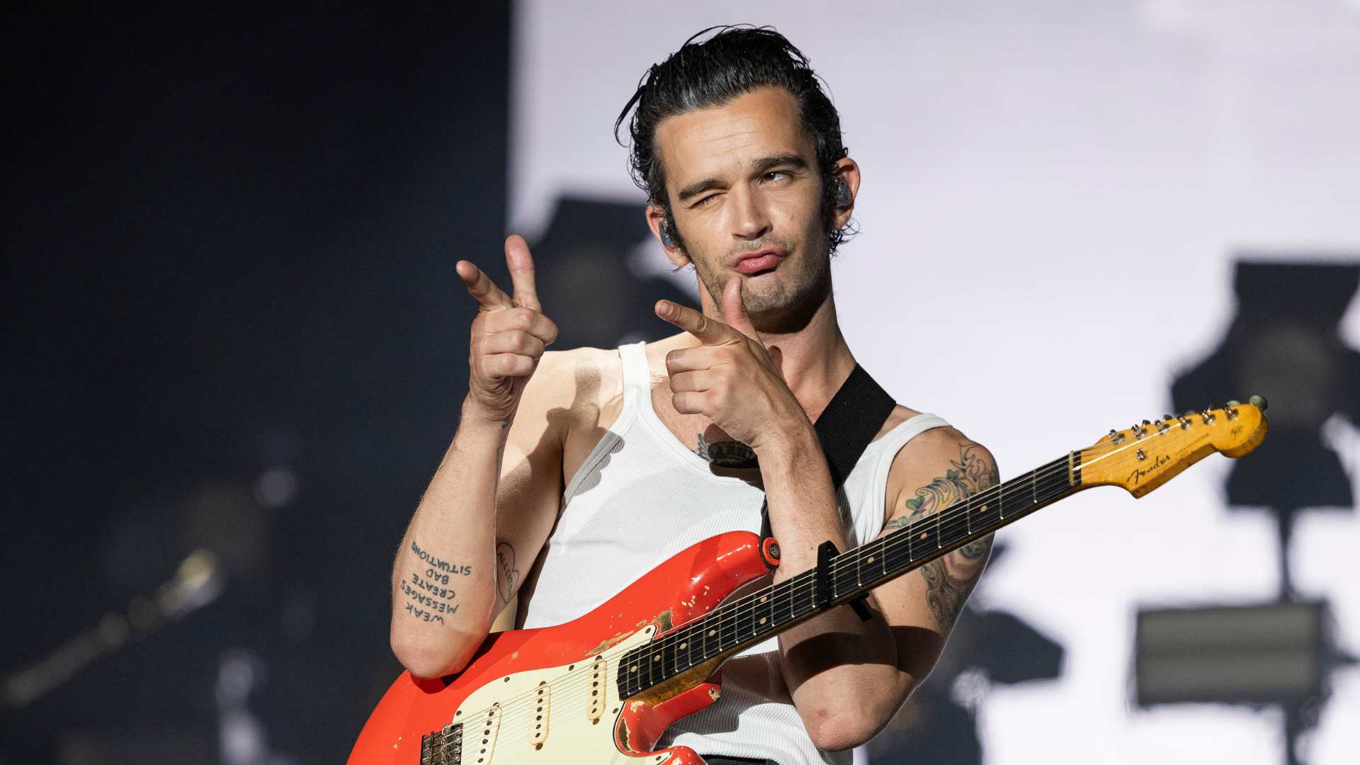 Same-sex kiss shouldn't make The 1975 members liable for cancelled festival costs, says lawyer