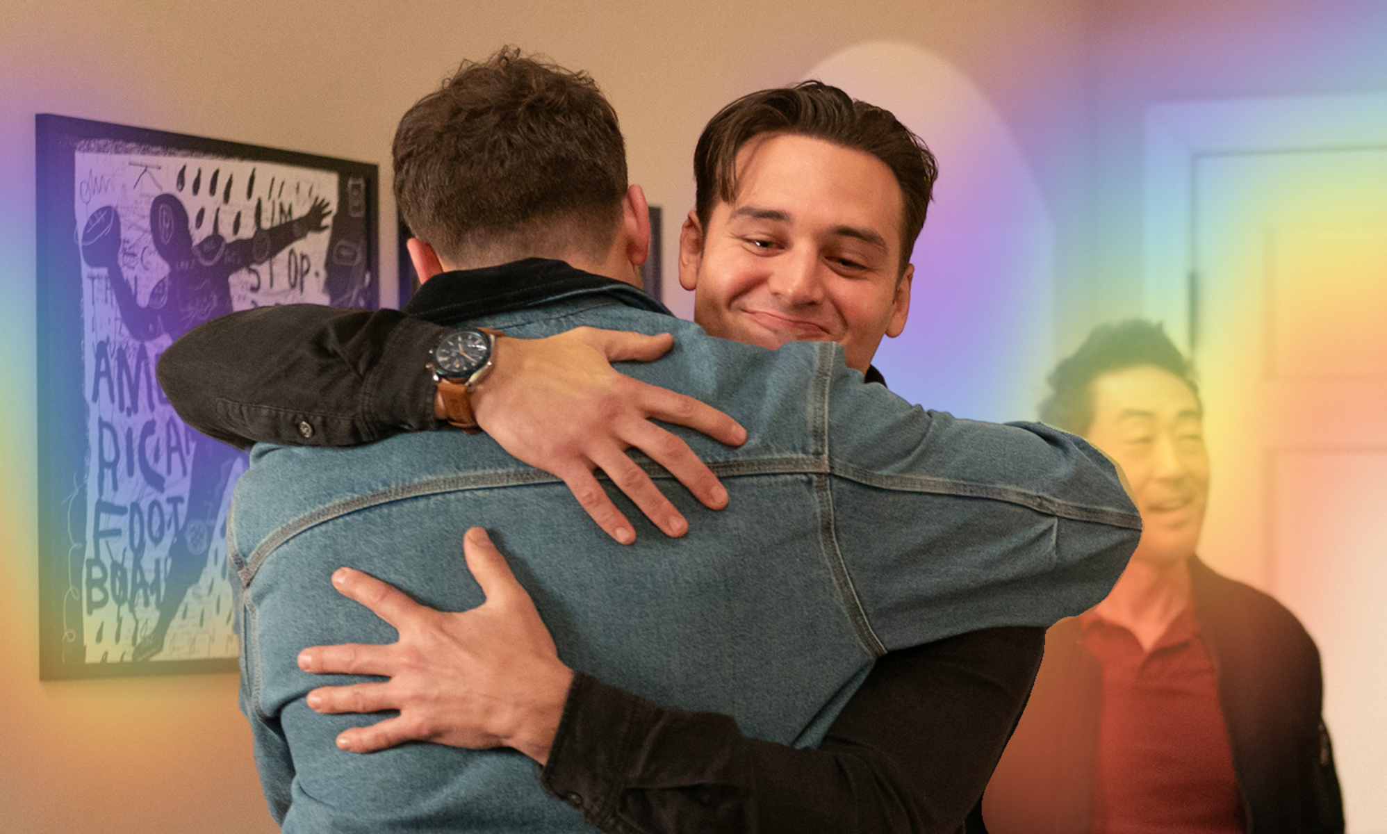 Buck and Eddie hugging it out with a rainbow light flare behind them.
