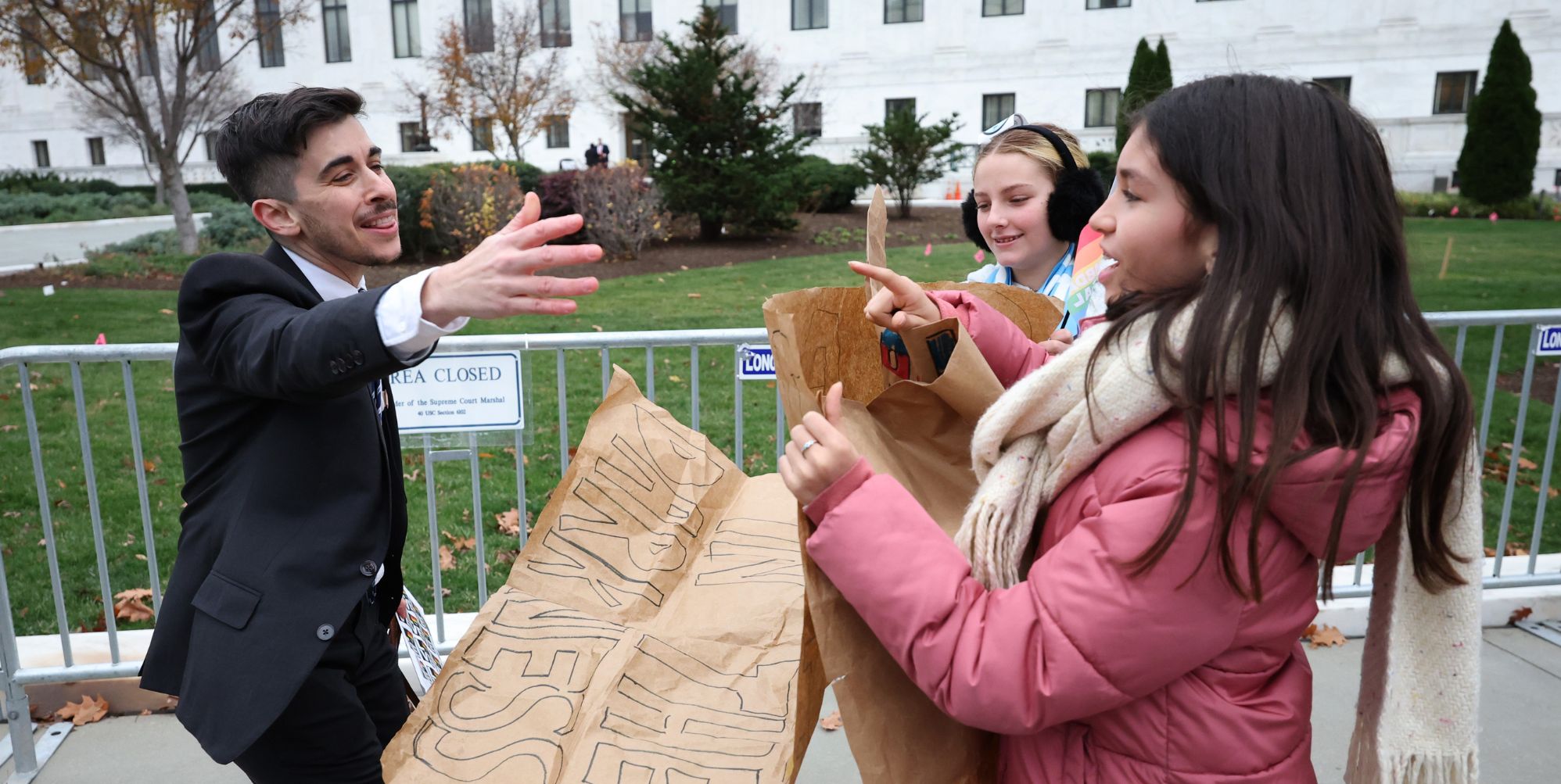 Chase Strangio greets supporters outside the US Supreme Court (Getty)