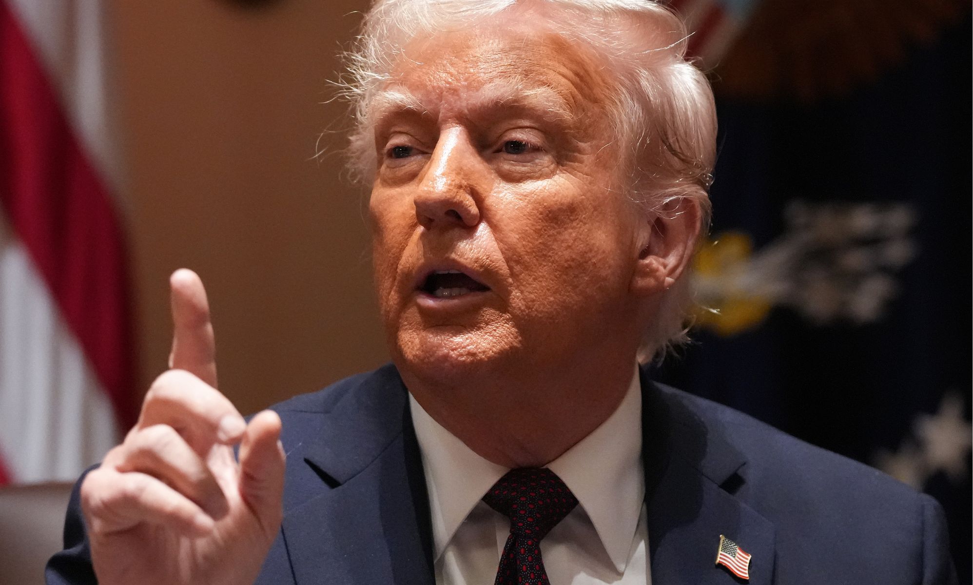 Donald Trump pointing in the air.