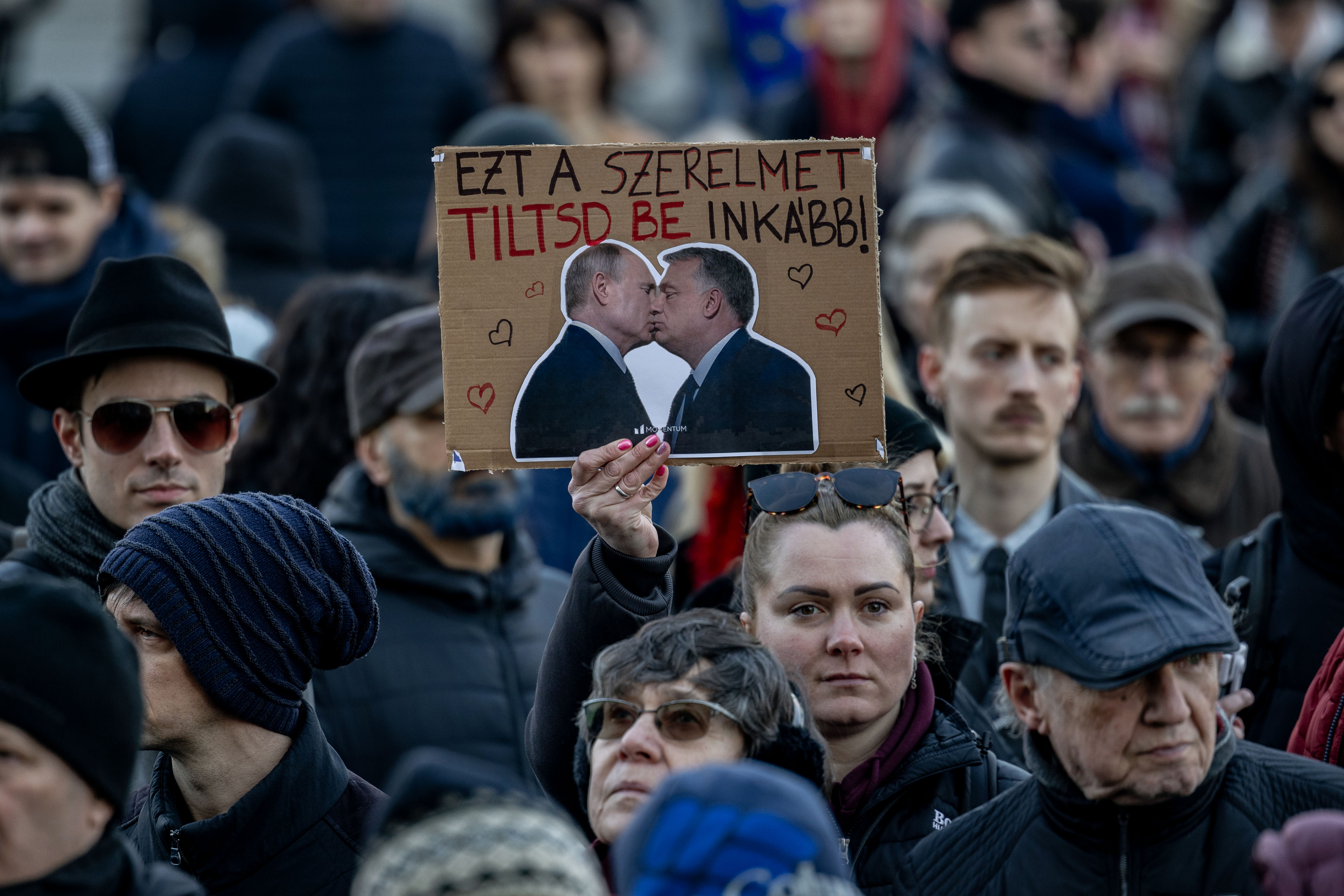 Furious Hungarian MPs throw photos of Orbán and Putin kissing in parliament after PM bans Pride