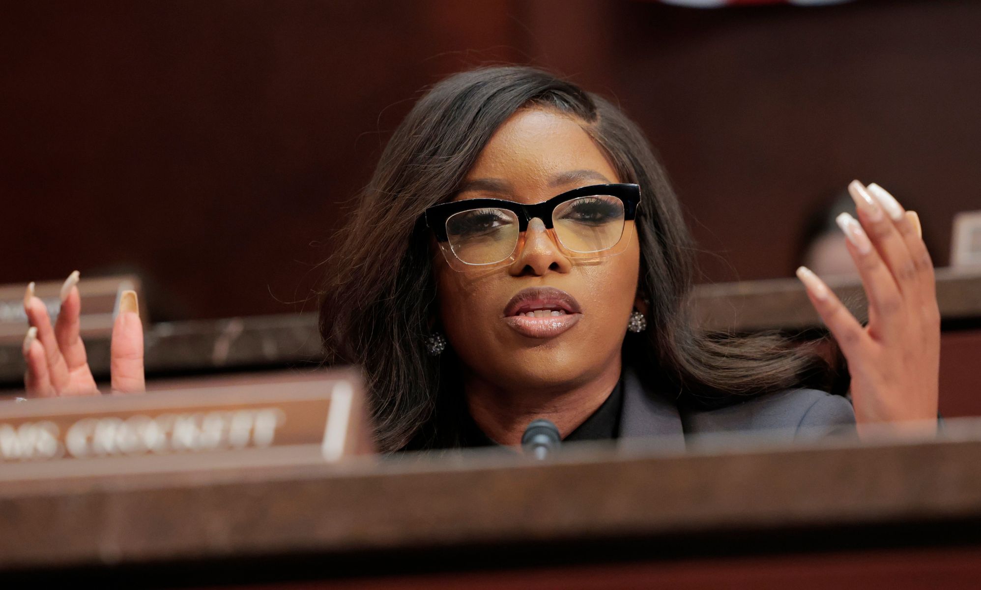 Jasmine Crockett shrugging during a session of US Congress.