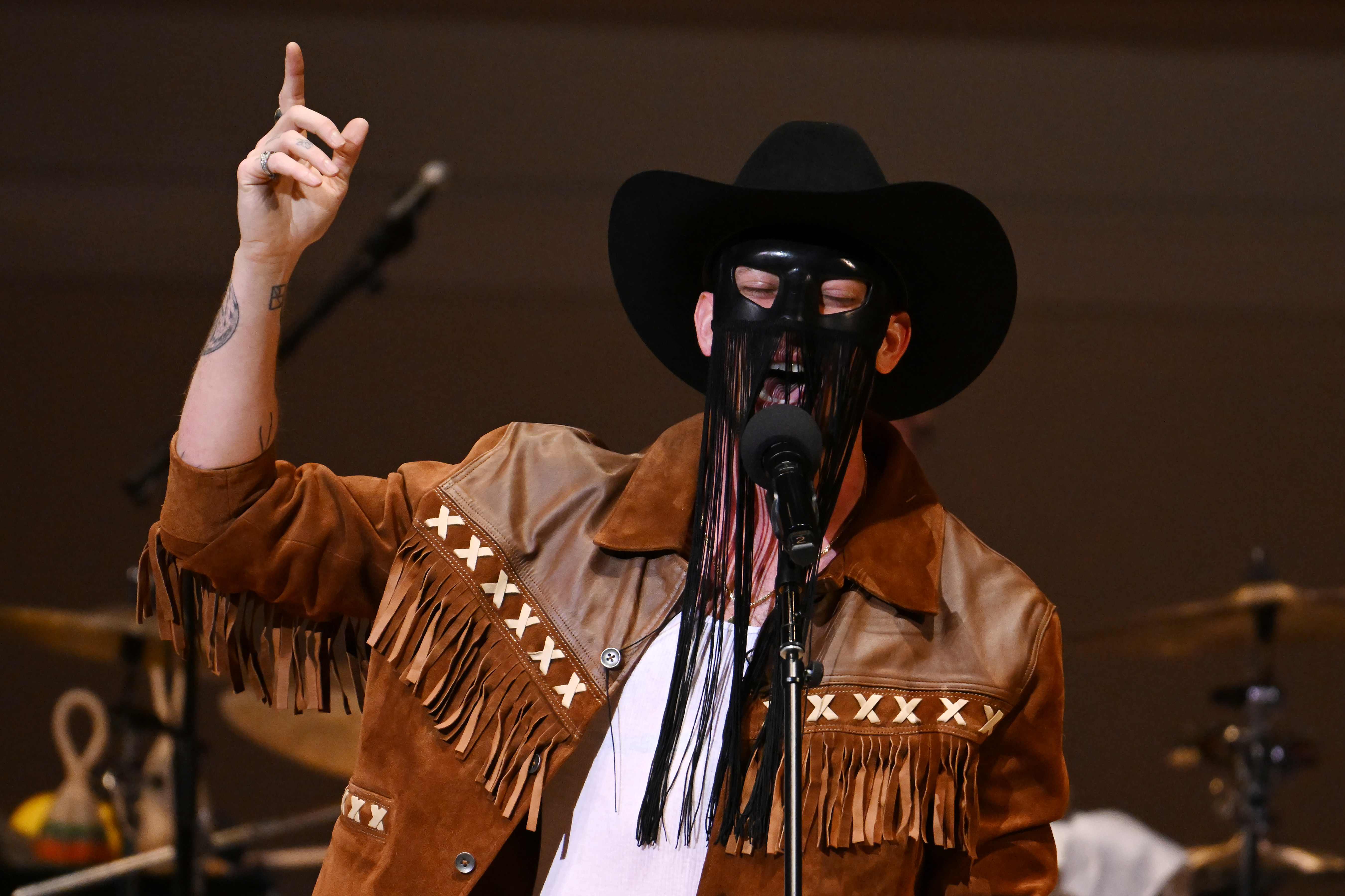 Gay country star Orville Peck is finally going to show everyone his face