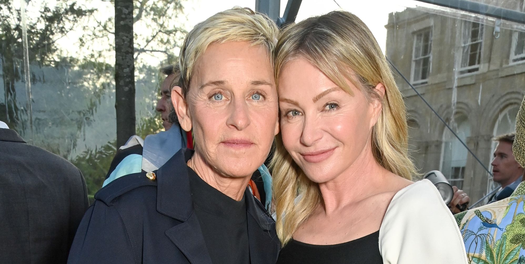 Ellen DeGeneres and Portia De Rossi smile and pose together in 2023.