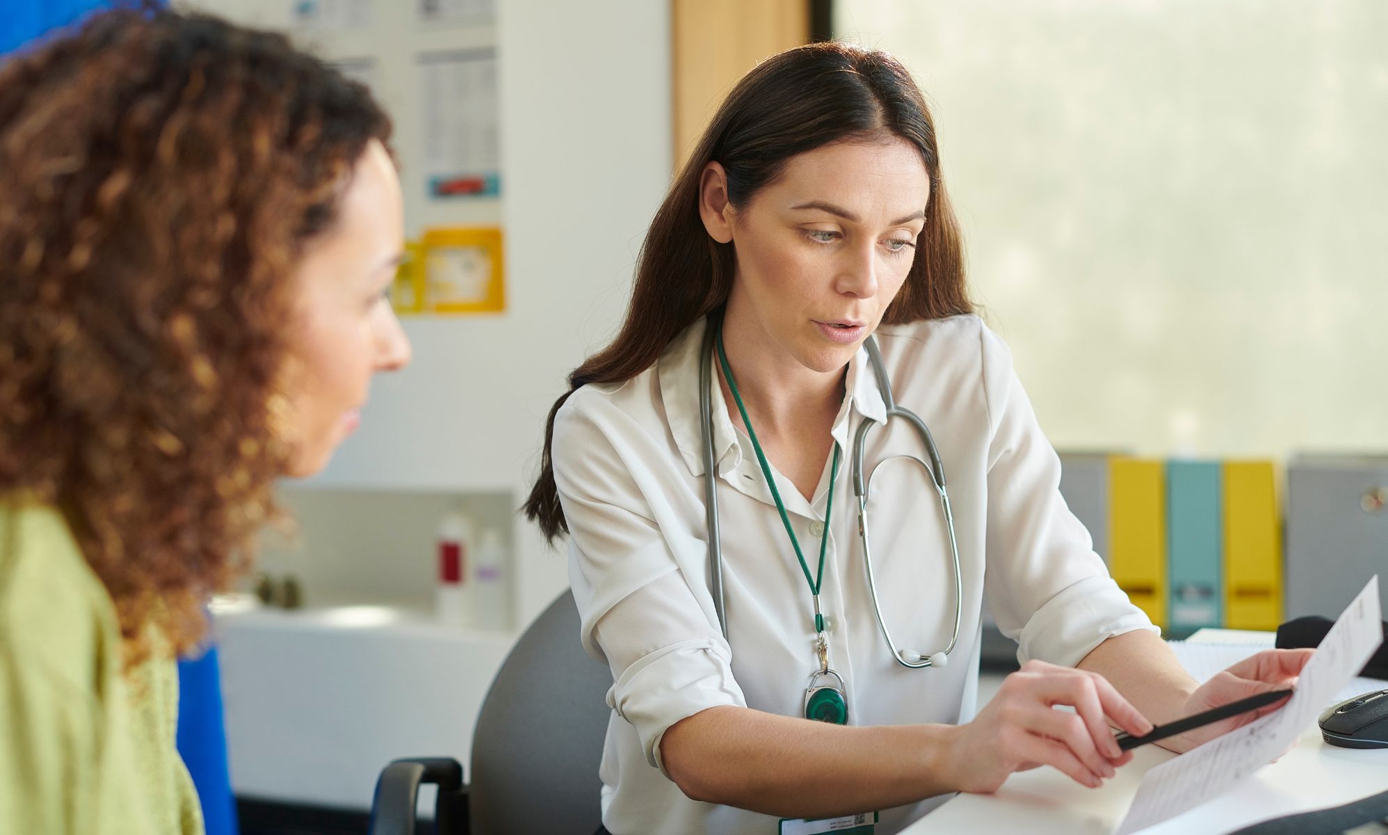A doctor and a patient during a GP appointment.