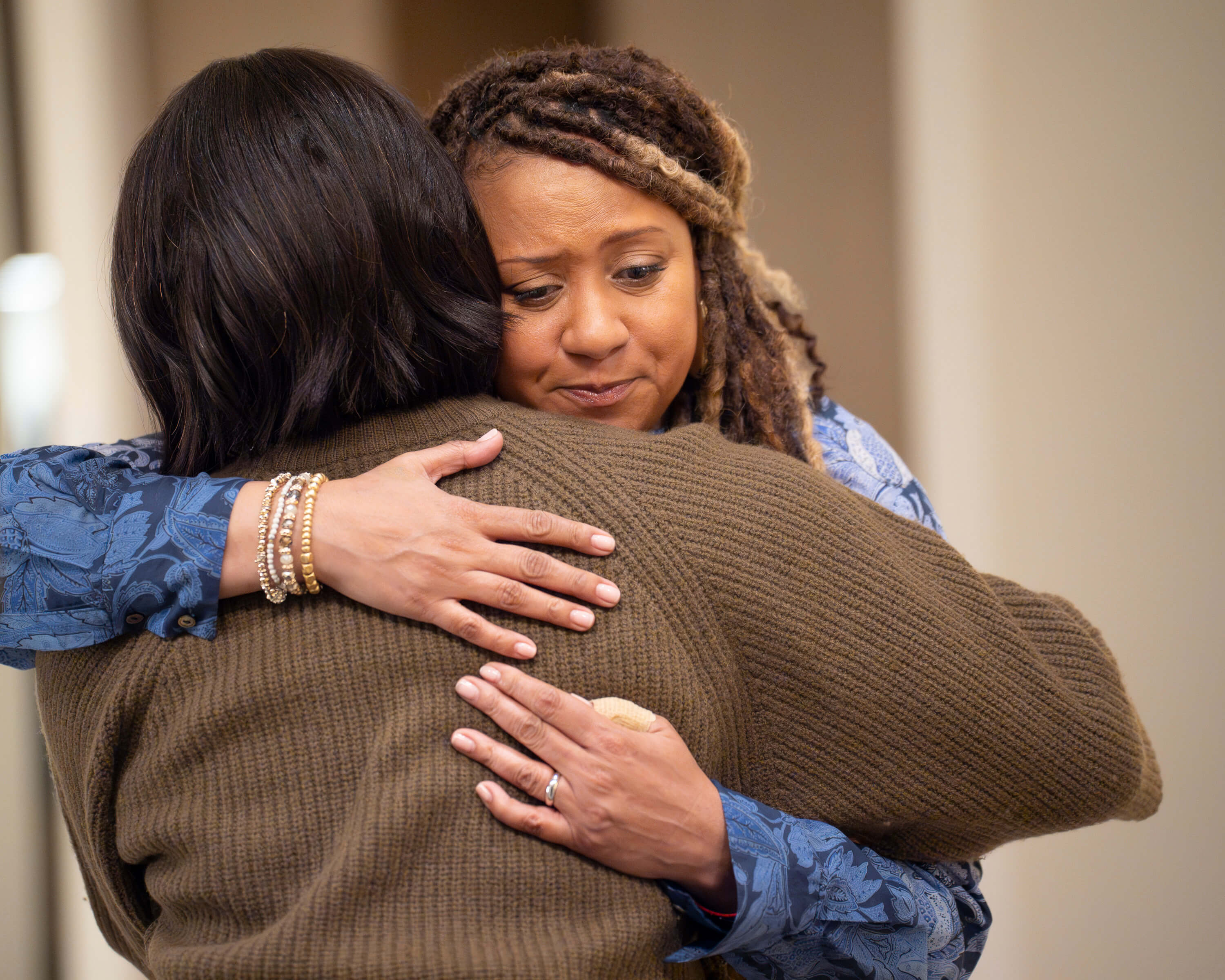 Karen and Athena hugging. 