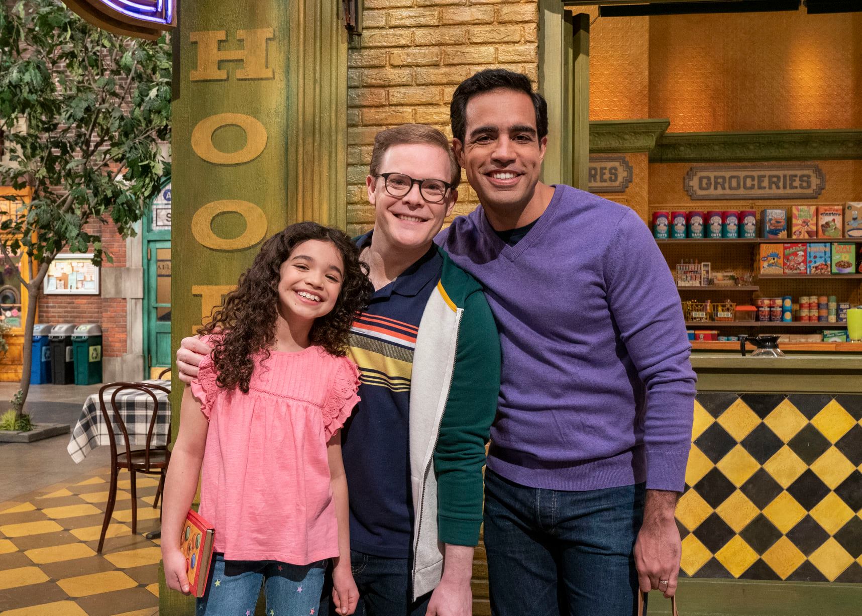 Mia (Olivia Perez) and her dads, Dave (Chris Costa) and Frank (Alex Weisman).