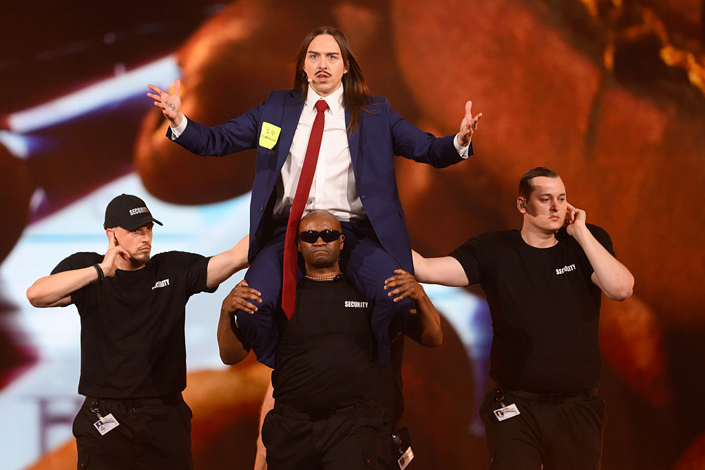 Tommy cash representing Estonia on stage at Eurovision