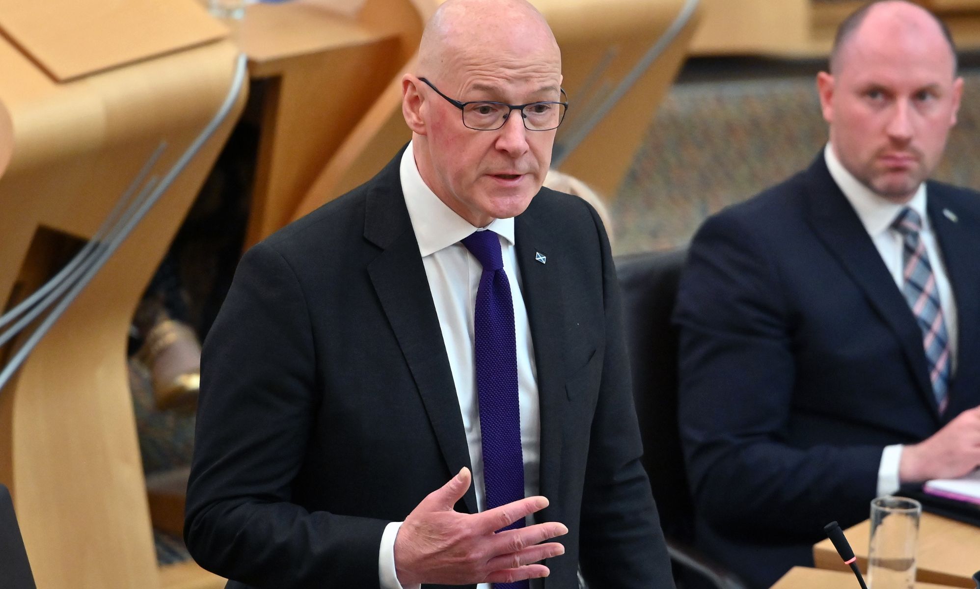 John Swinney speaking in Holyrood.
