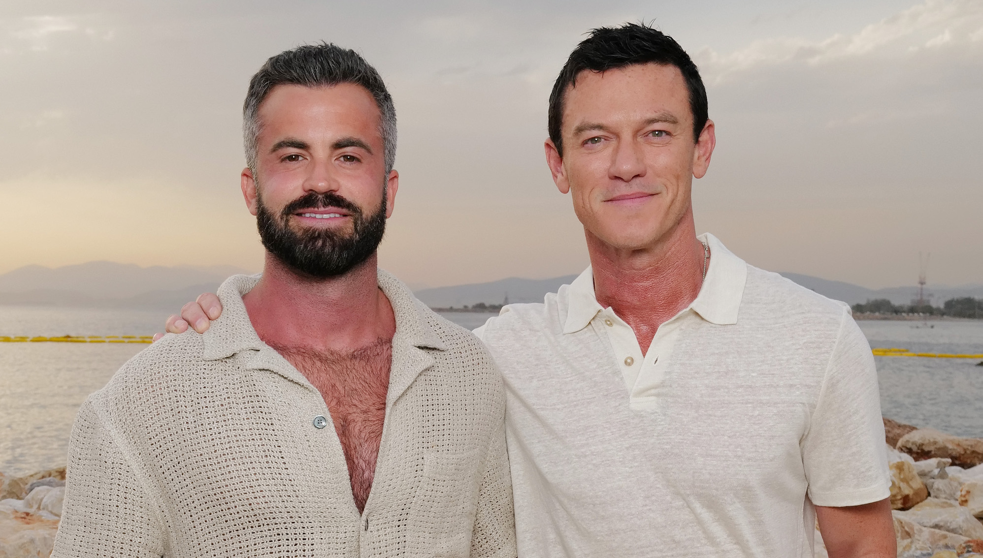Luke Evans shows off his skimpy swimwear line with boyfriend Fran Tomas