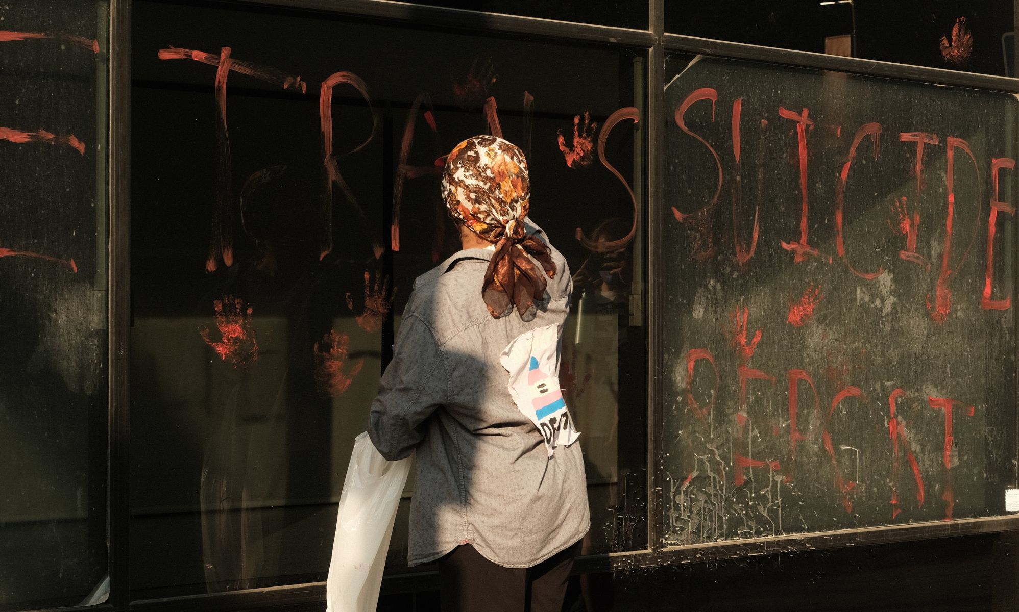 Trans youth leave 'bloody' handprints on NHS HQ to protest unpublished report