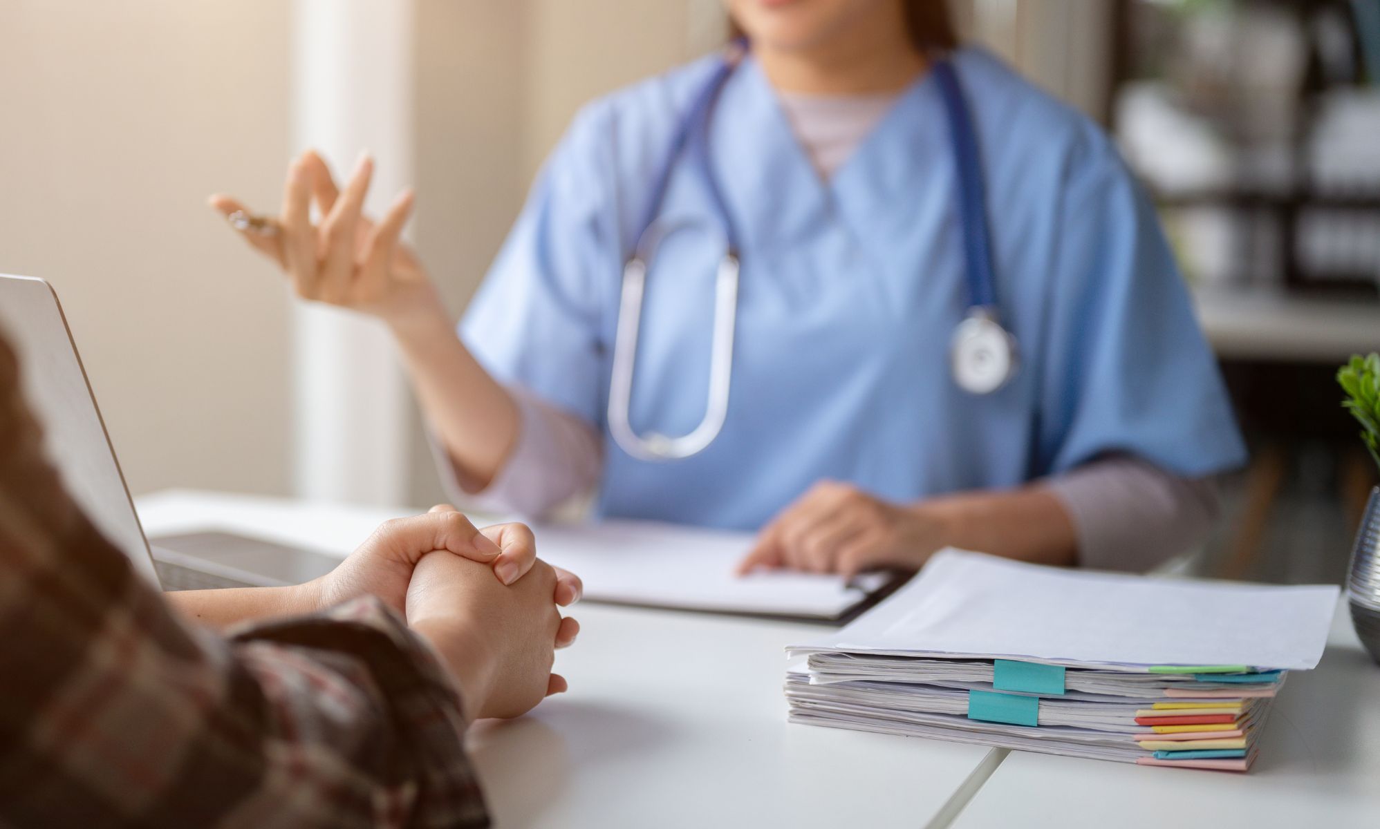A medical professional speaking to a patient.