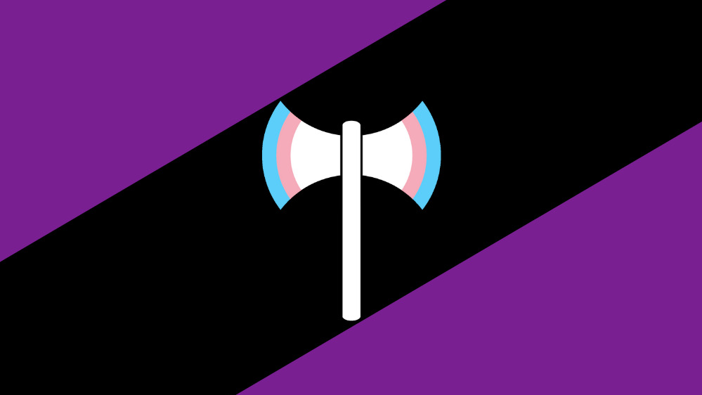 A new Labrys Pride flag features a double-headed axe with trans flag colours on a violet and black stripped background.