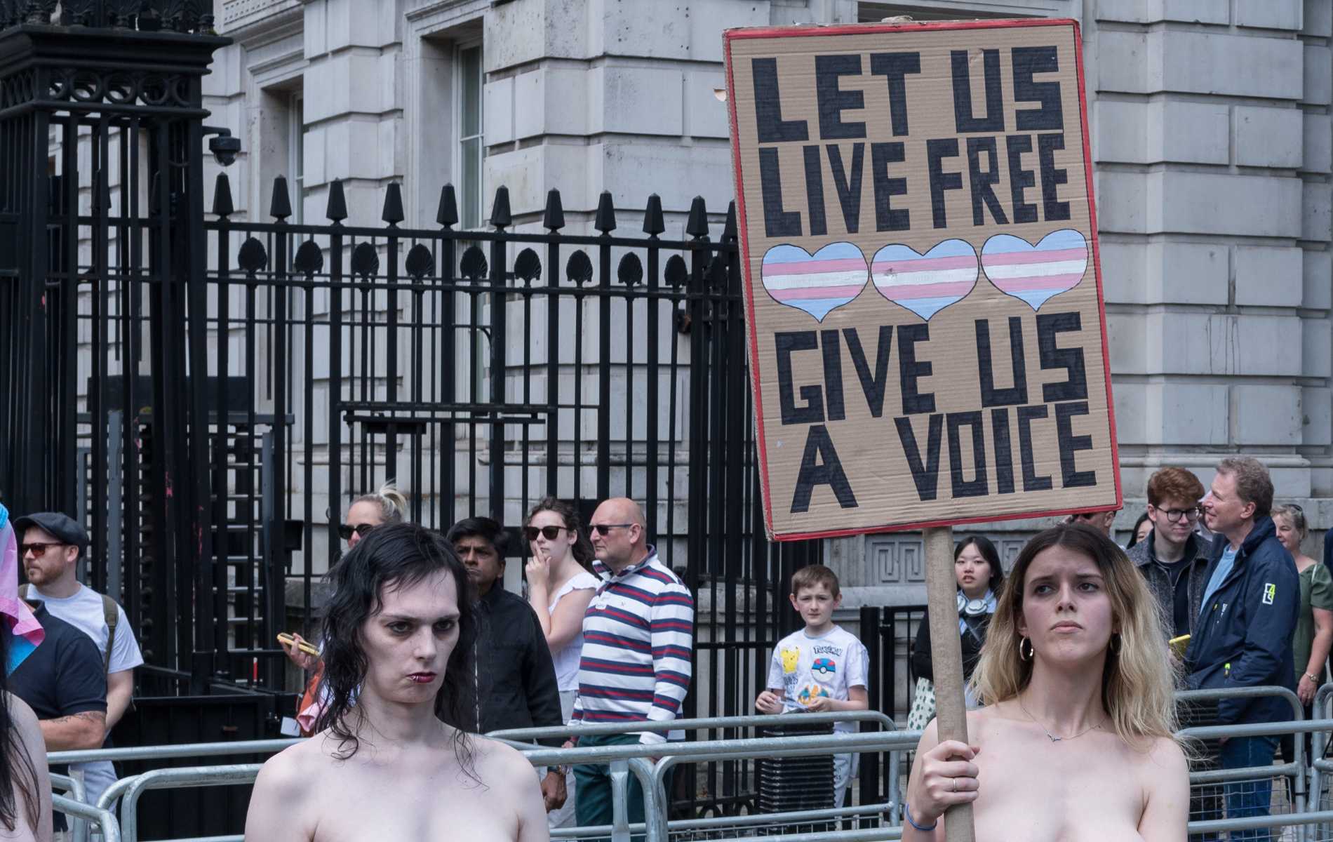 Topless trans folks protest outside Downing Street in 'deeply symbolic act'
