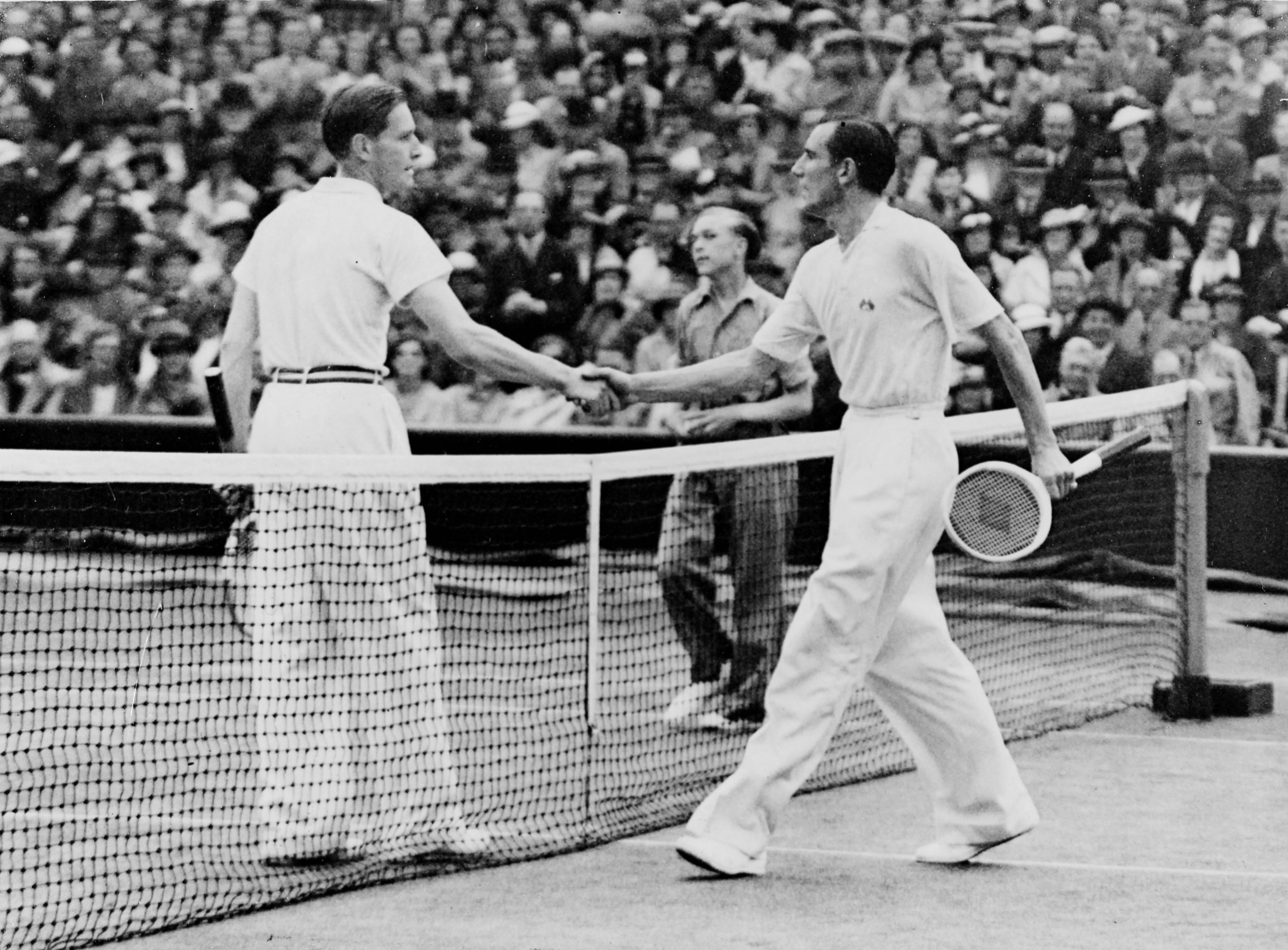 Shake hands between the British table tennis player Fred Perry and German tennis player Gottfried von Cramm at Wimbledon