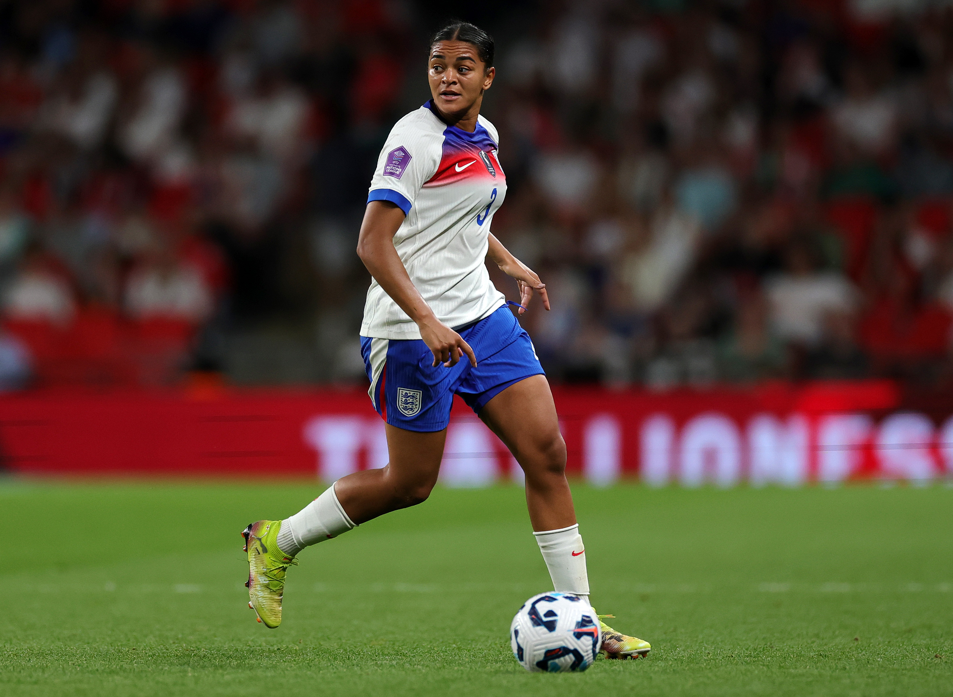 Jess Carter on the pitch in the England football kit