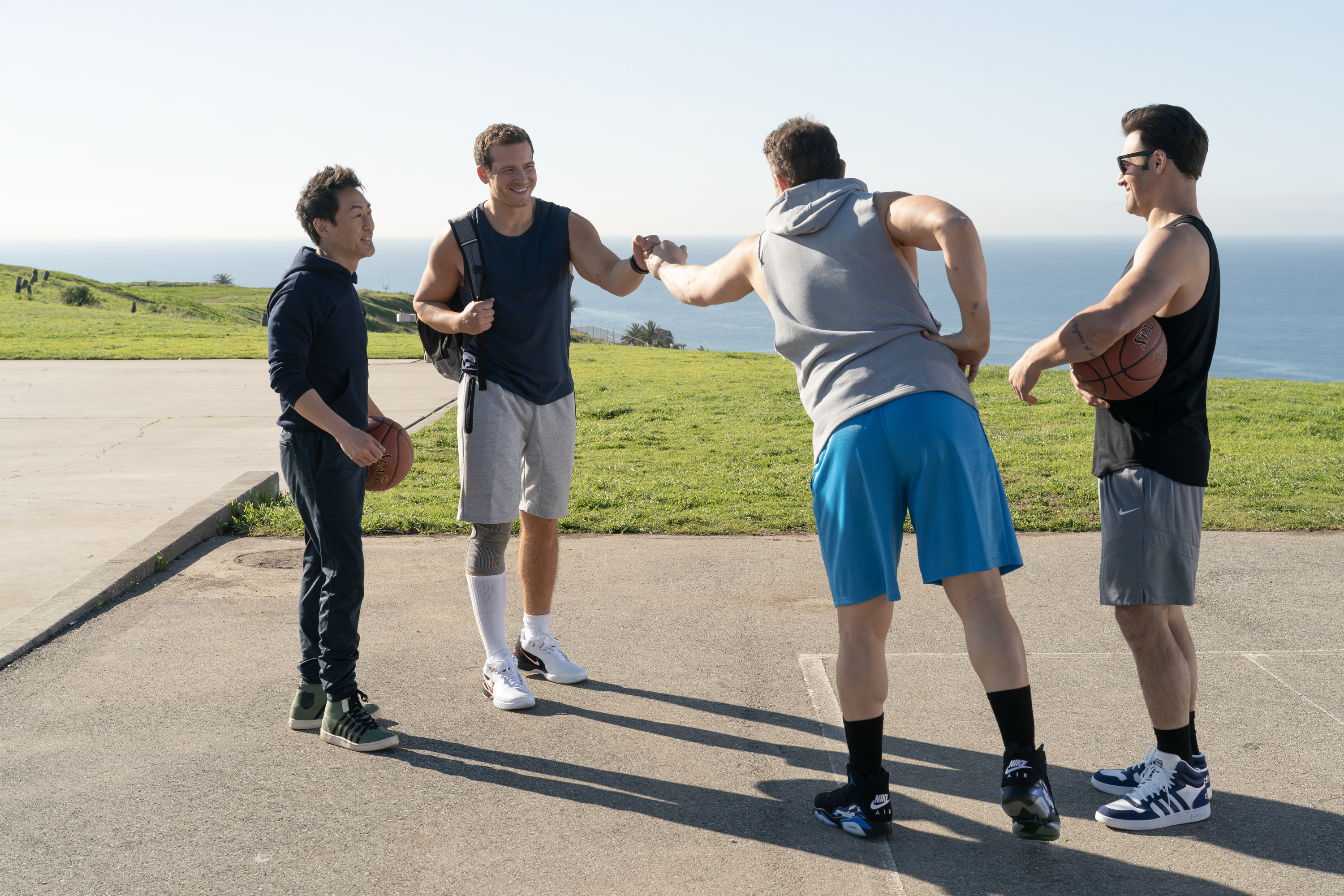 9-1-1 characters Chimney, Buck, Tommy and Eddie on a basketball court.