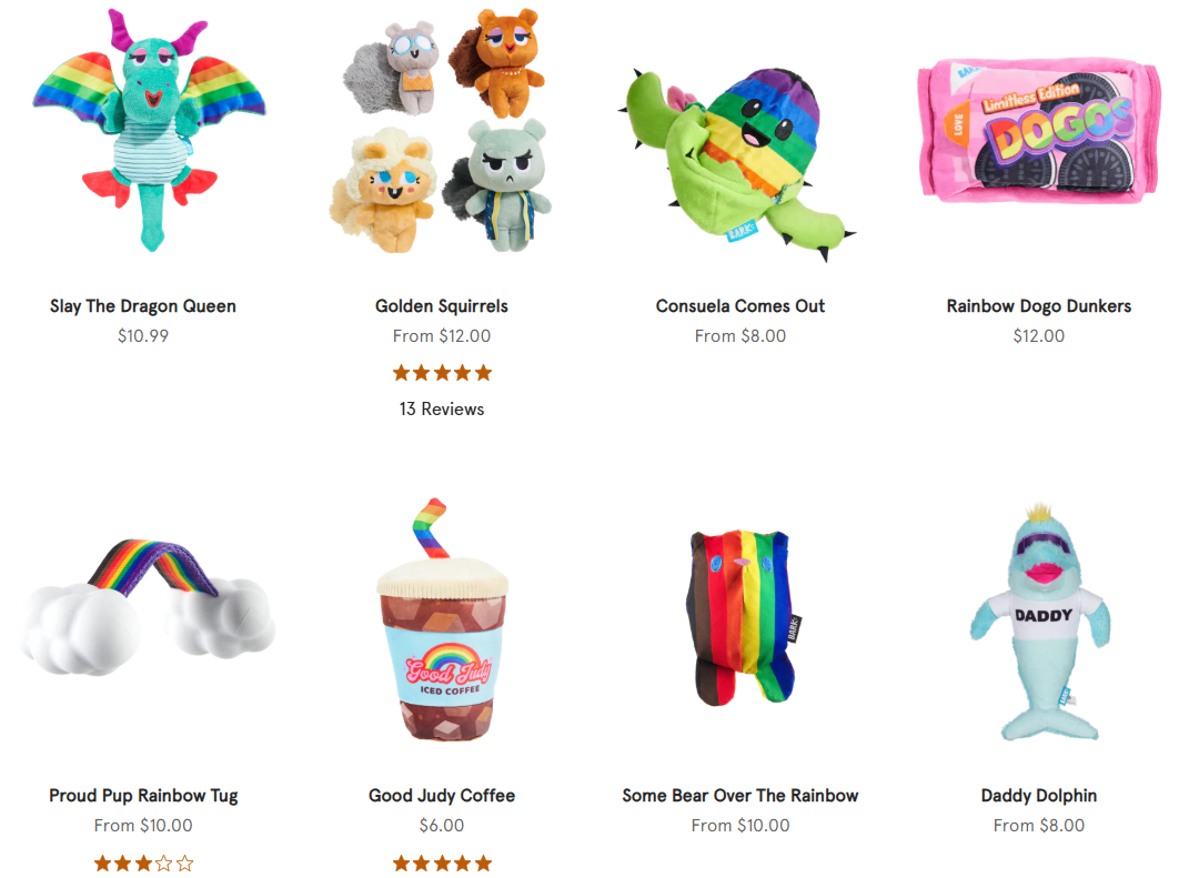A selection of plus rainbow themed dog toys including a dragon, a coffee mug, a dolphin and a packet of cookies, all part of Bark.co