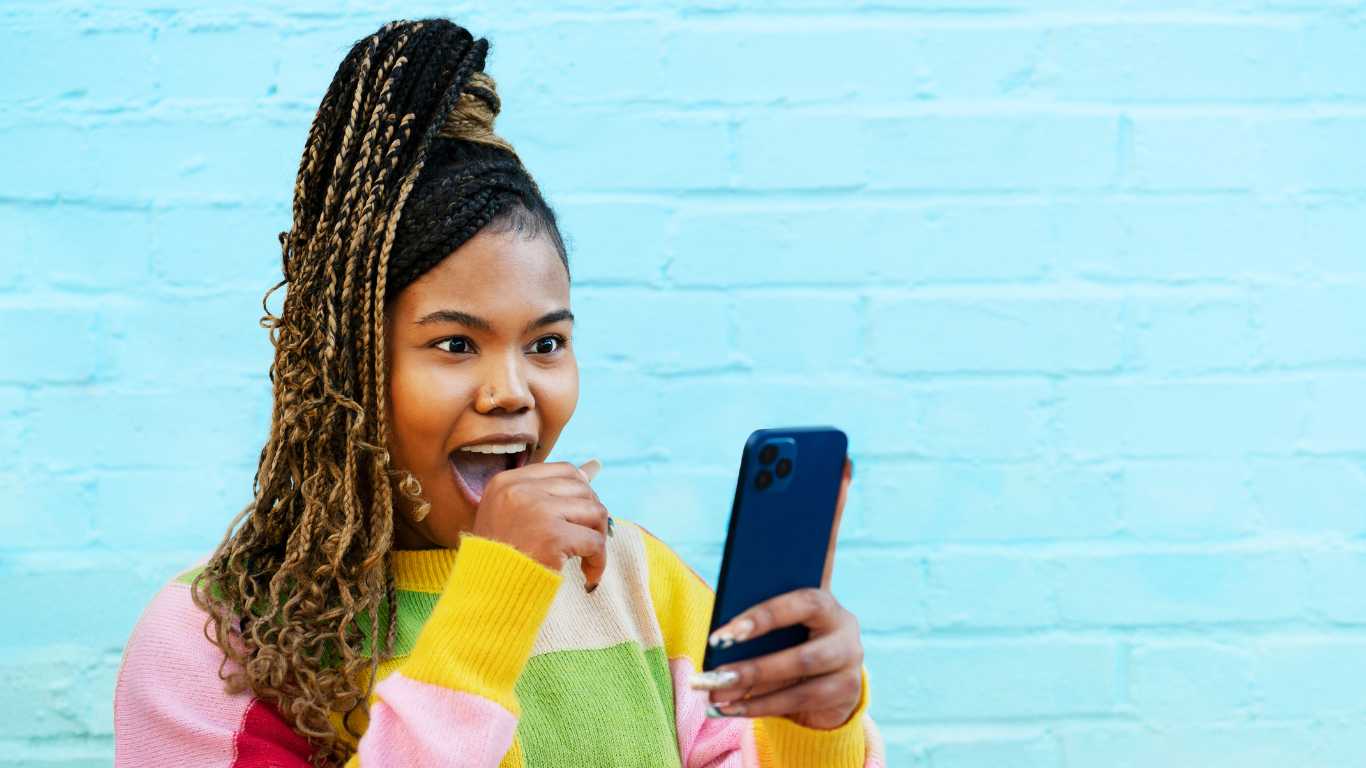 Woman reacting to smart phone