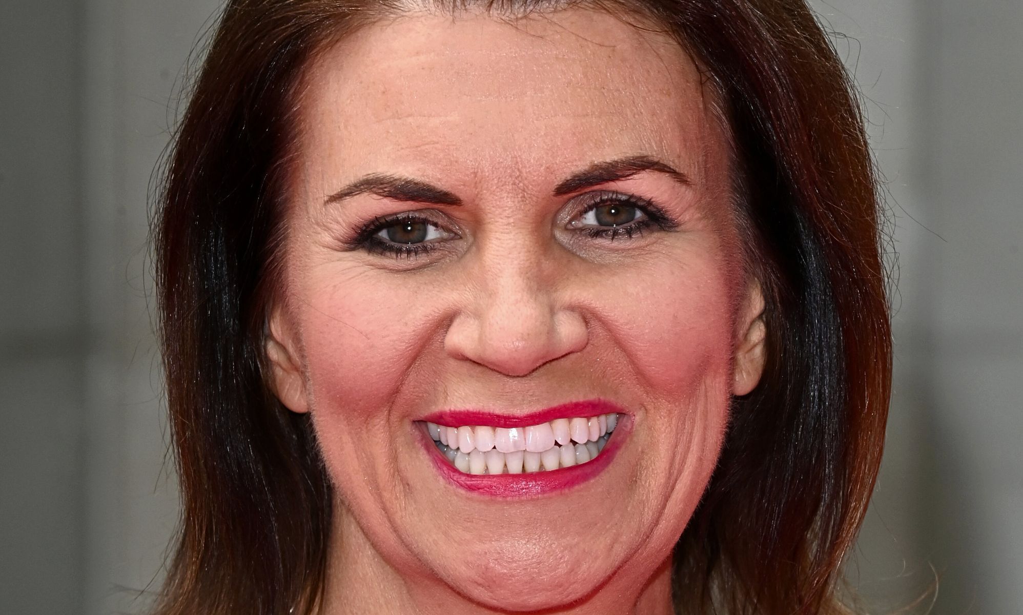 TalkTV host, Julia Hartley-Brewer, pictured smiling.