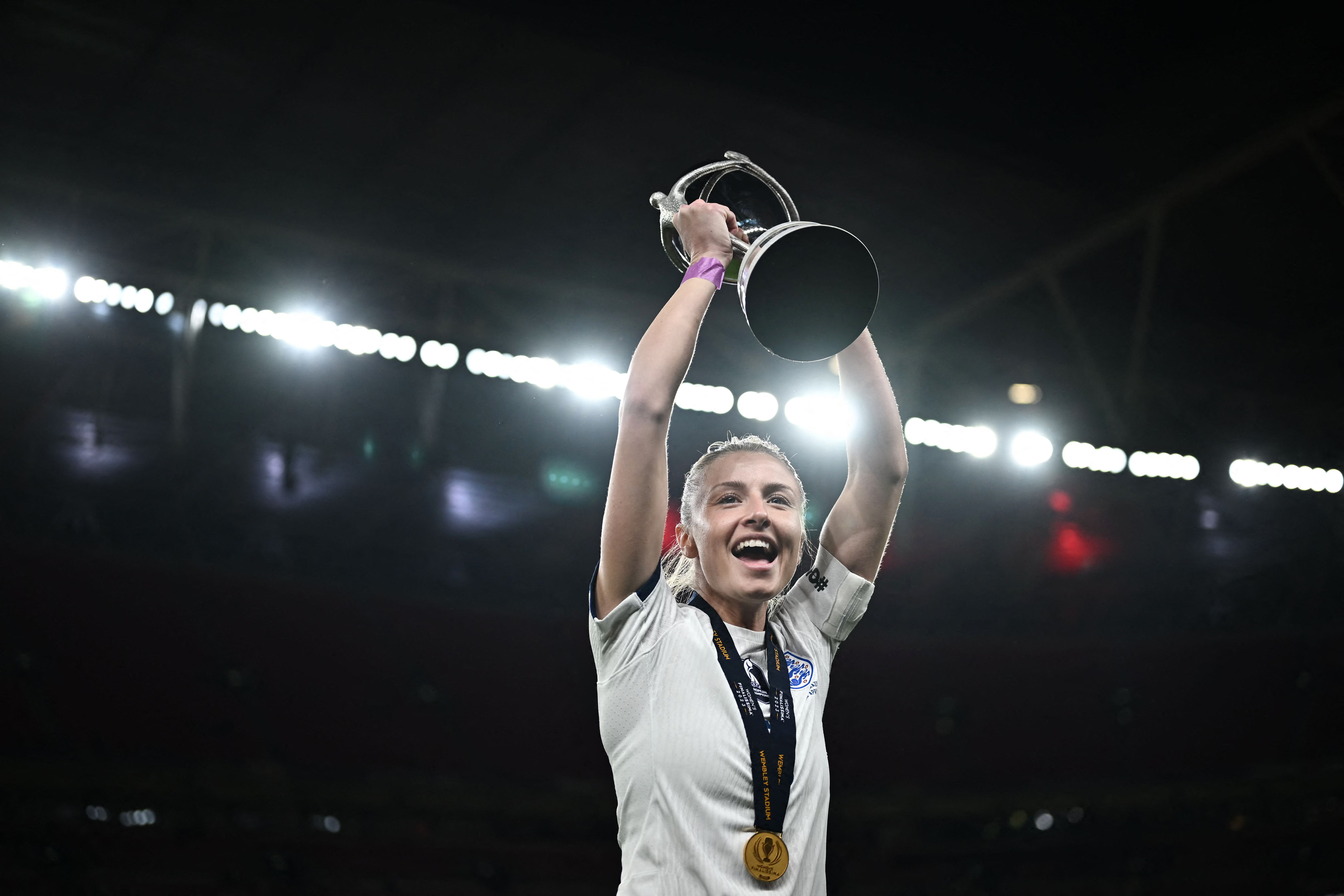 Leah Williamson celebrates with the trophy after England