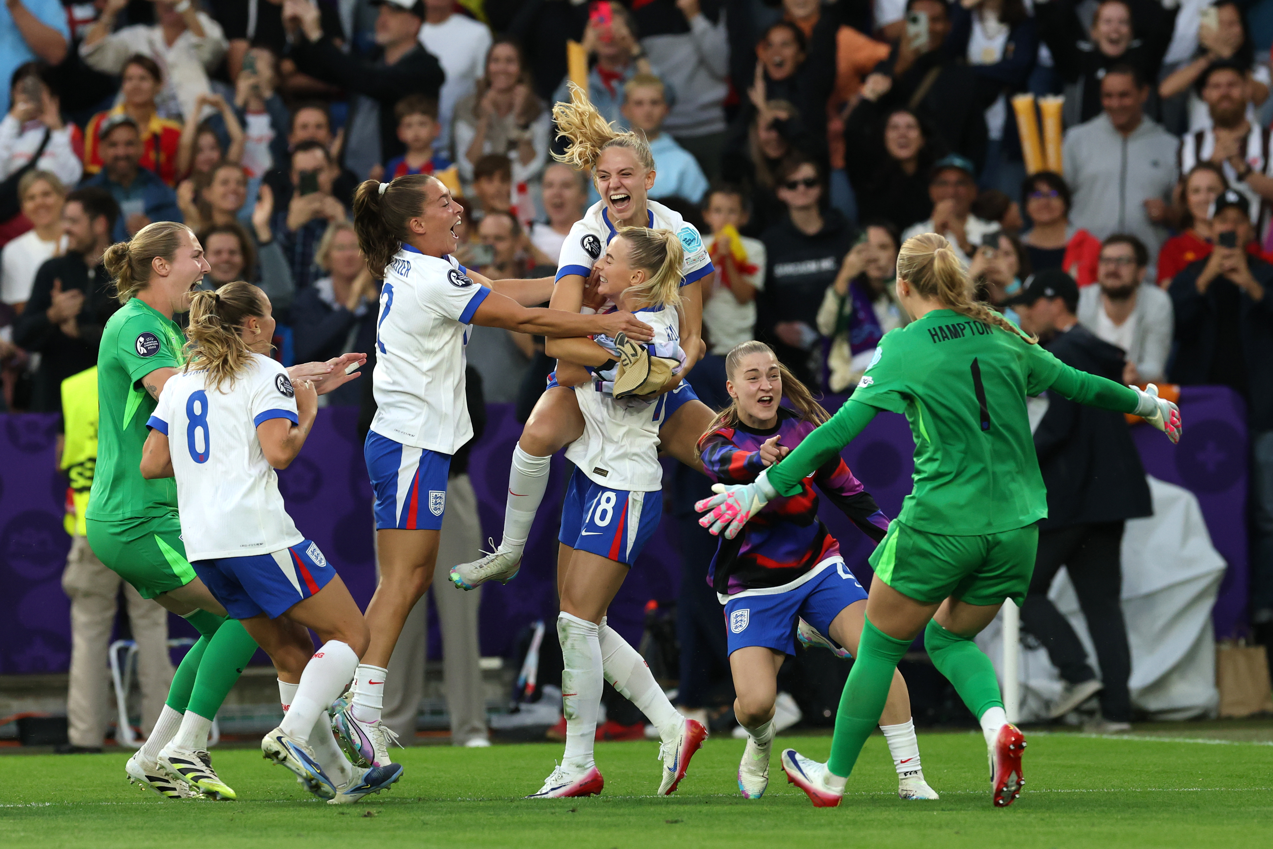 Chloe Kelly of England celebrates with teammates following the team