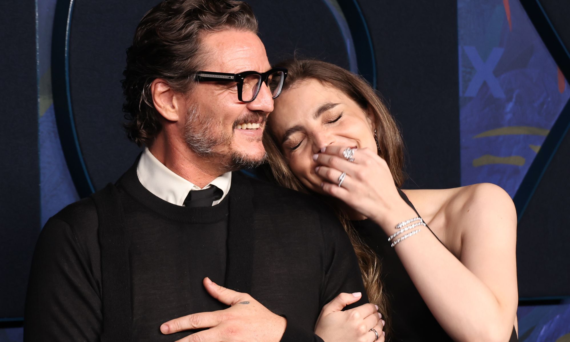 Lux and Pedro Pascal during a red carpet premiere.