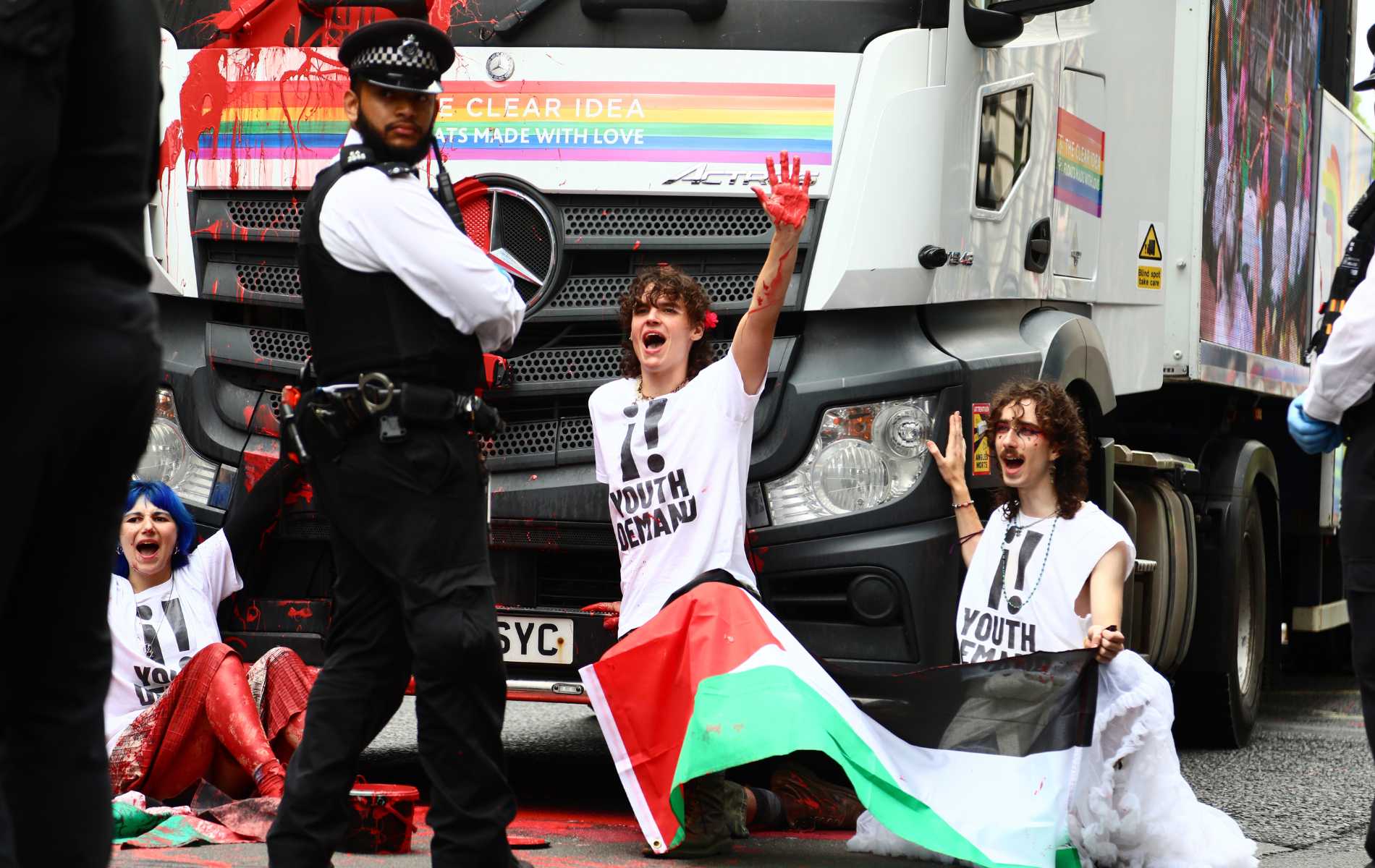 Pro-Palestine protesters glue themselves to parade float during Pride in London